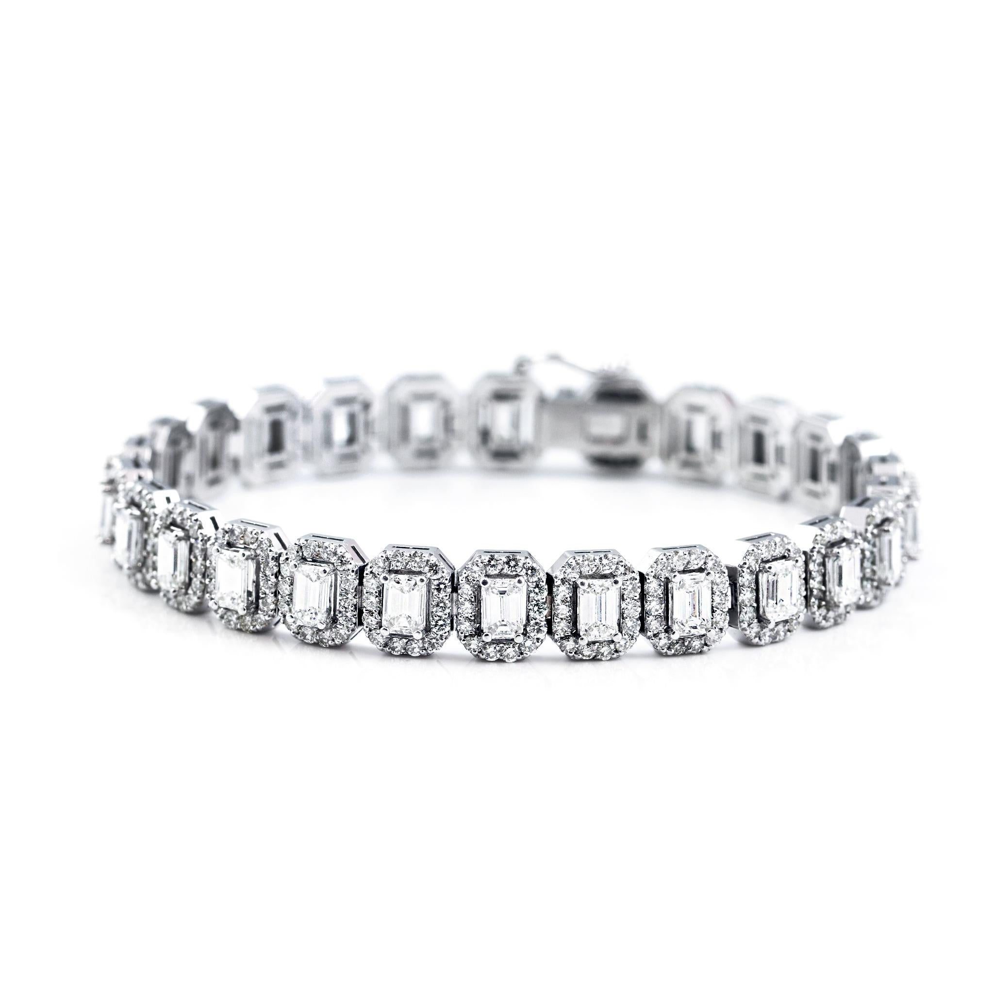 This elegant diamond bracelet showcases a timeless design crafted in 14K white gold, featuring 23 emerald-cut diamonds, each beautifully framed by a halo of round brilliant-cut diamonds. With a total carat weight of approximately 8.35 carats, this