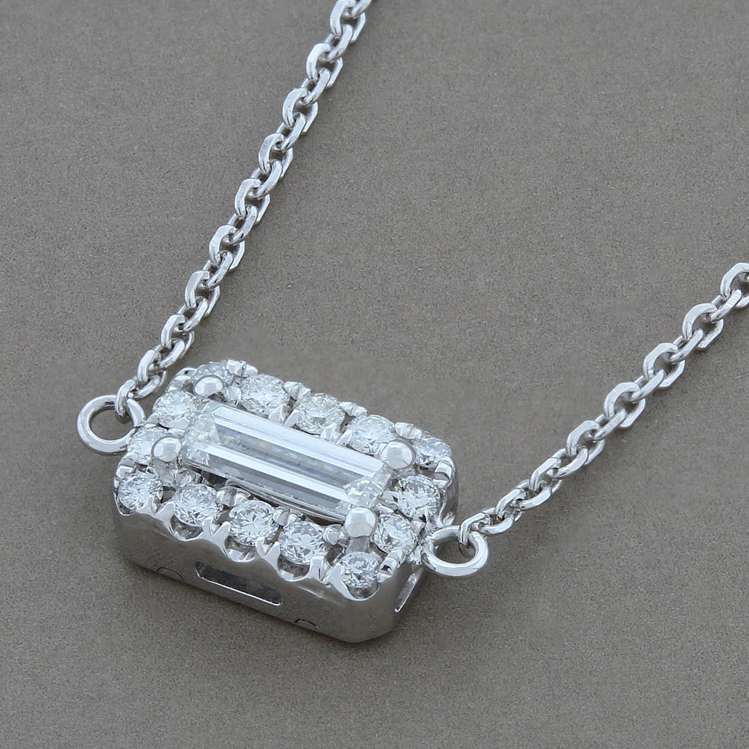 This everyday necklace features 0.50 carats of diamonds. The center emerald cut diamond is set on its side and is surrounded by a halo of round cut diamonds.  All diamonds are colorless VS quality.

Necklace Length: 17 inches with an adjustable loop