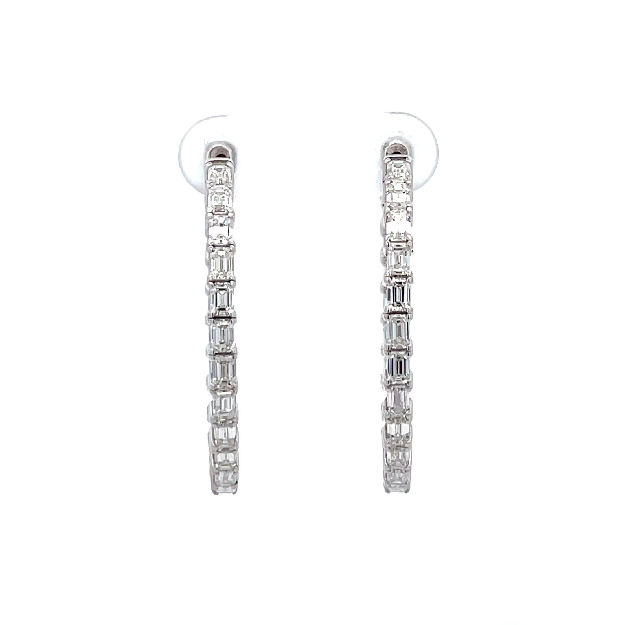 Inside out diamond hoop earrings featuring 44 Emerald cuts weighing 4.01 Carats in 14 Karat White gold. 
Color G
Clarity VVS2-VS2
Average 0.09 Points Each
