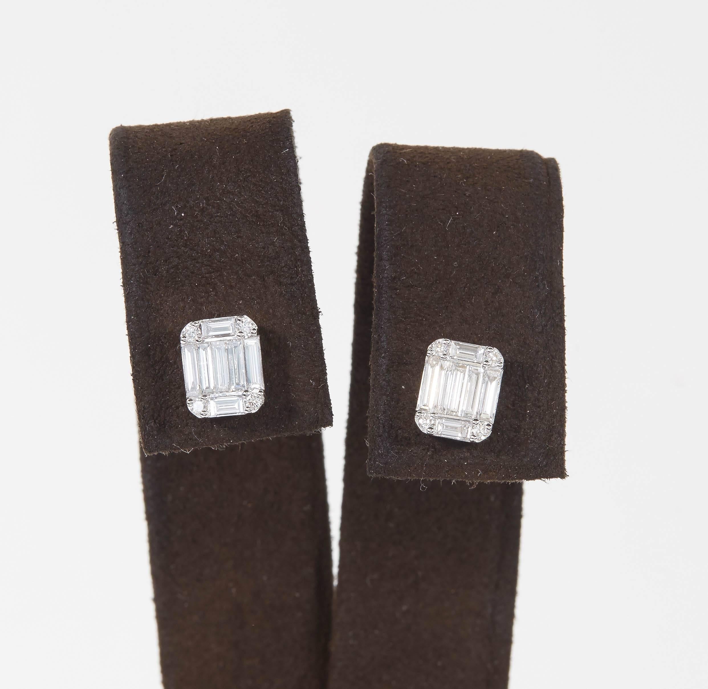 

A beautiful pair of diamond stud earrings. 

Made up of baguette and round cut diamonds, this earring has tons of sparkle and gives the look of one emerald cut diamond. 

1.01 carats of F VS diamonds set in 18k white gold.

Approximately 7.9 mm x