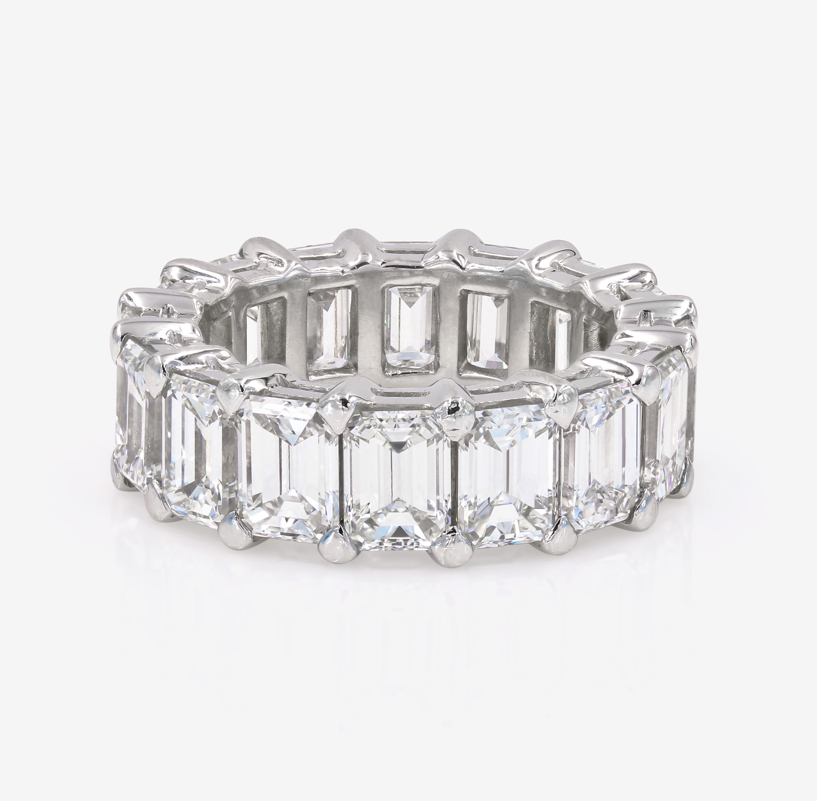 A beautifully made eternity band is set in platinum with 16 Emerald cut Diamonds = 12.16cts. tw. They average .76ct. each stone.

Diamonds are G-H Color and VS Clarity. Ring was hand made by us in 2005 and recently traded in.  The ring has been