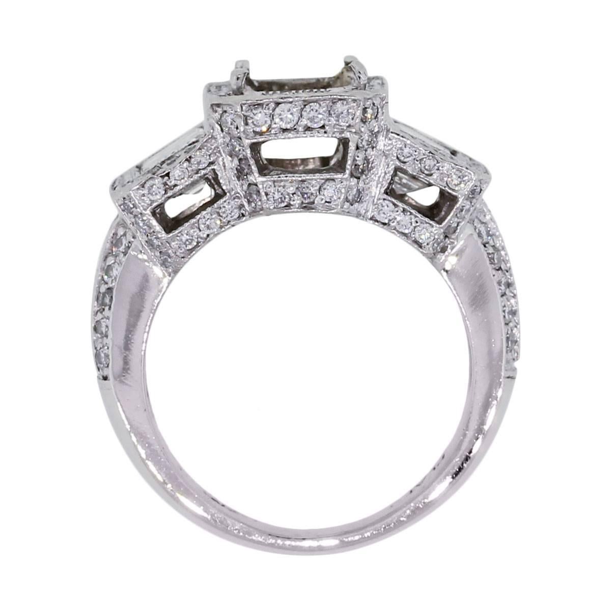 Material: Platinum
Diamond Details: Approximately 2.50ctw emerald cut diamonds and round brilliant diamonds. Diamonds are G/H in color and VS in clarity.
Mounting Details: 4 prong mounting, can accept emerald shape stone up to 7.24mm x 5.35mm
Ring