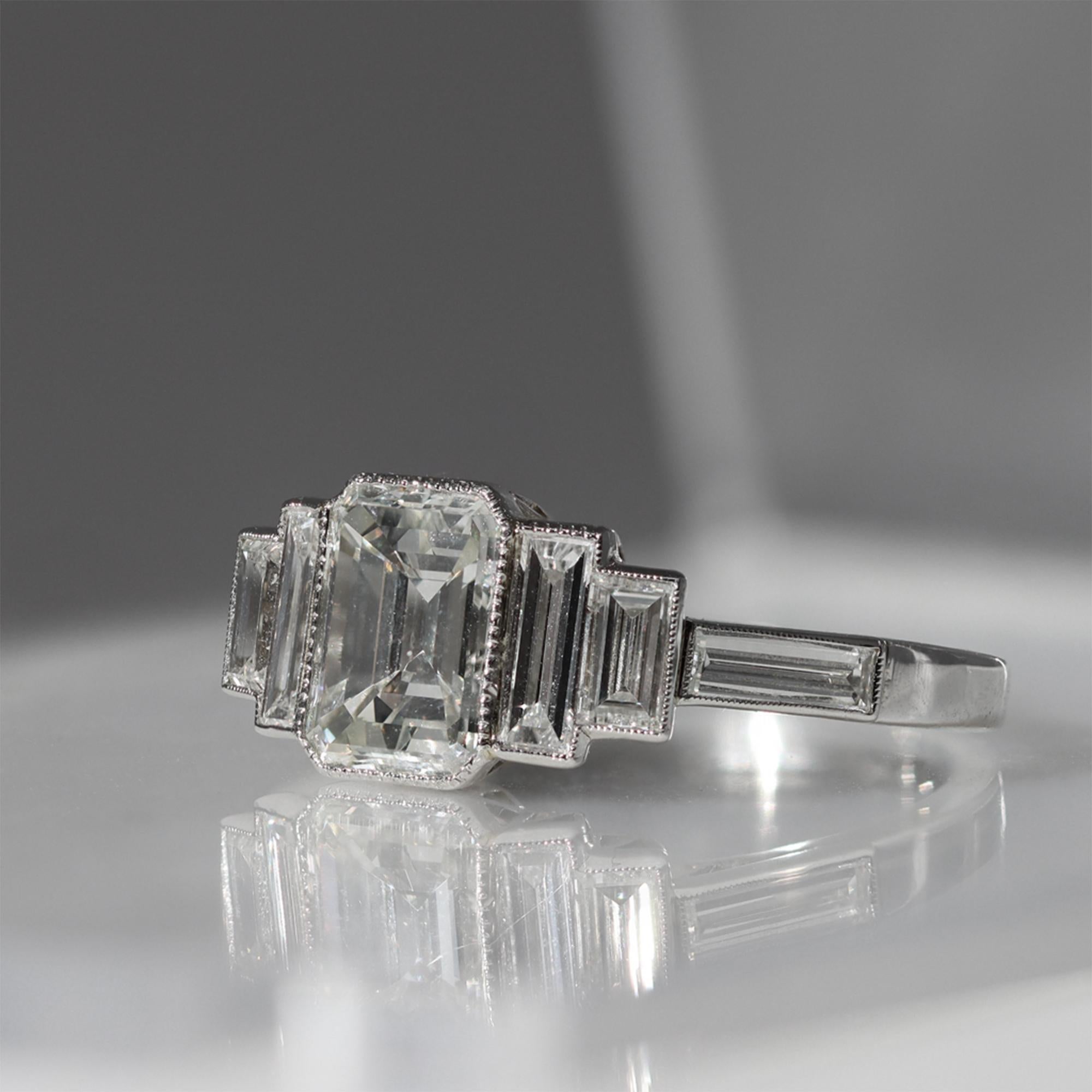 Emerald Cut Emerald-Cut Diamond Ring with Side Baguettes Set in Platinum For Sale