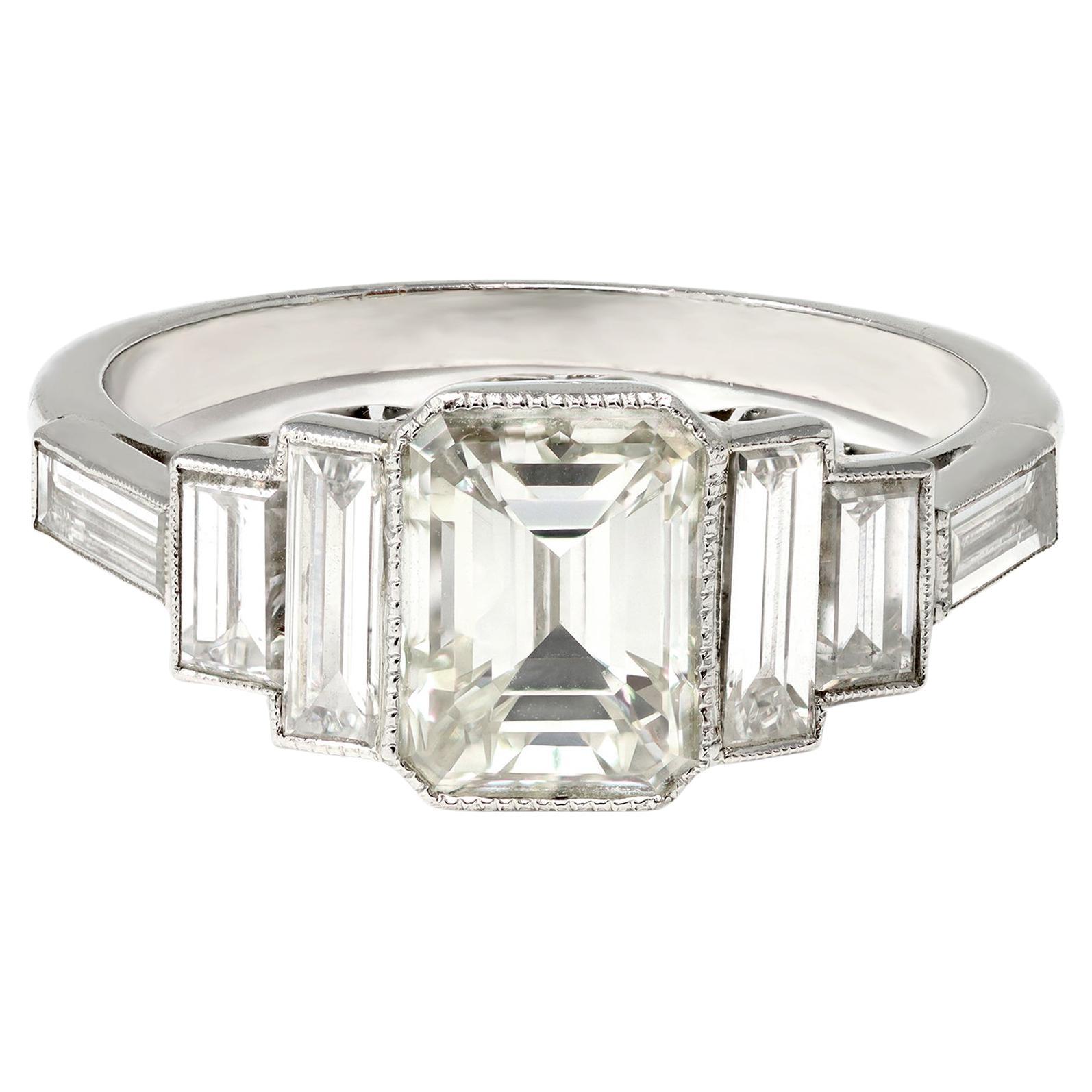 Emerald-Cut Diamond Ring with Side Baguettes Set in Platinum For Sale
