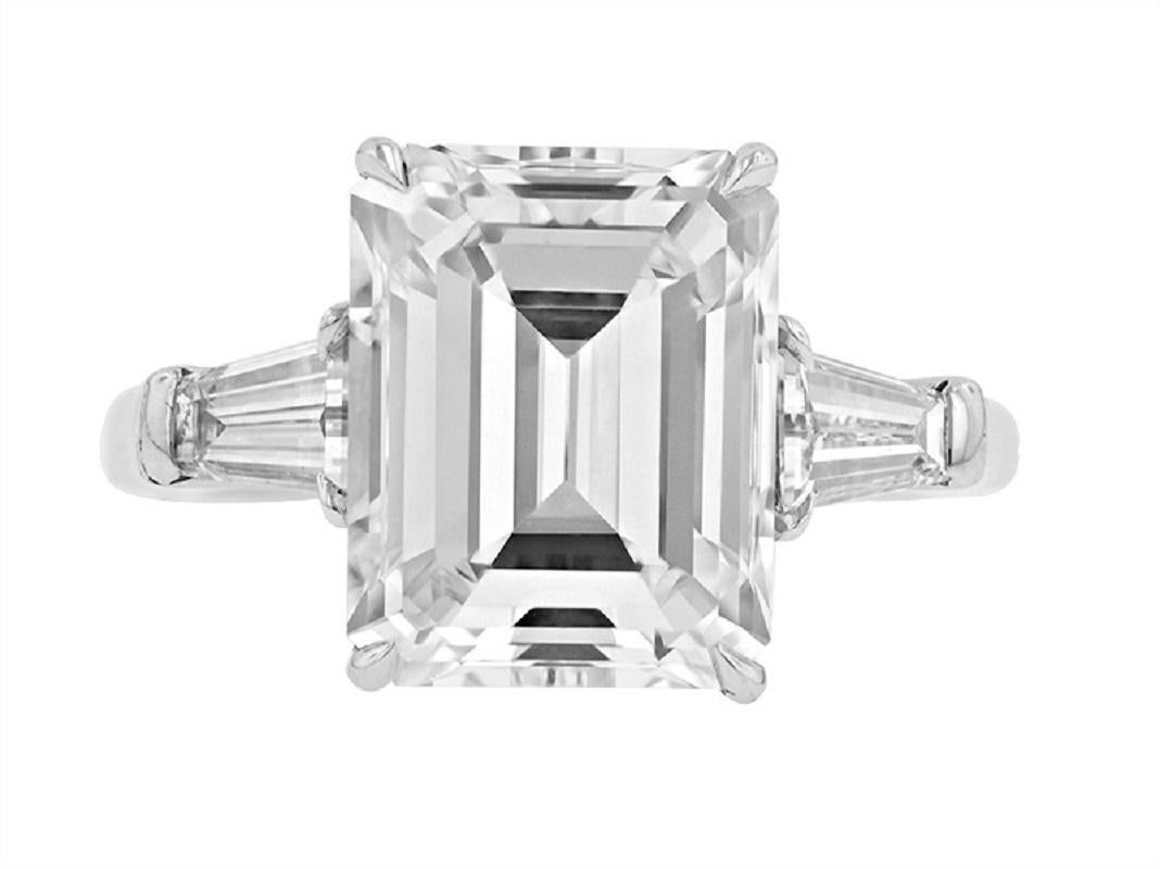 Emerald cut diamond ring features with 6.35 ct center stone (GIA certified I, vs1, GIA #2135911508) set with .91ct of tapered baguettes diamonds 
