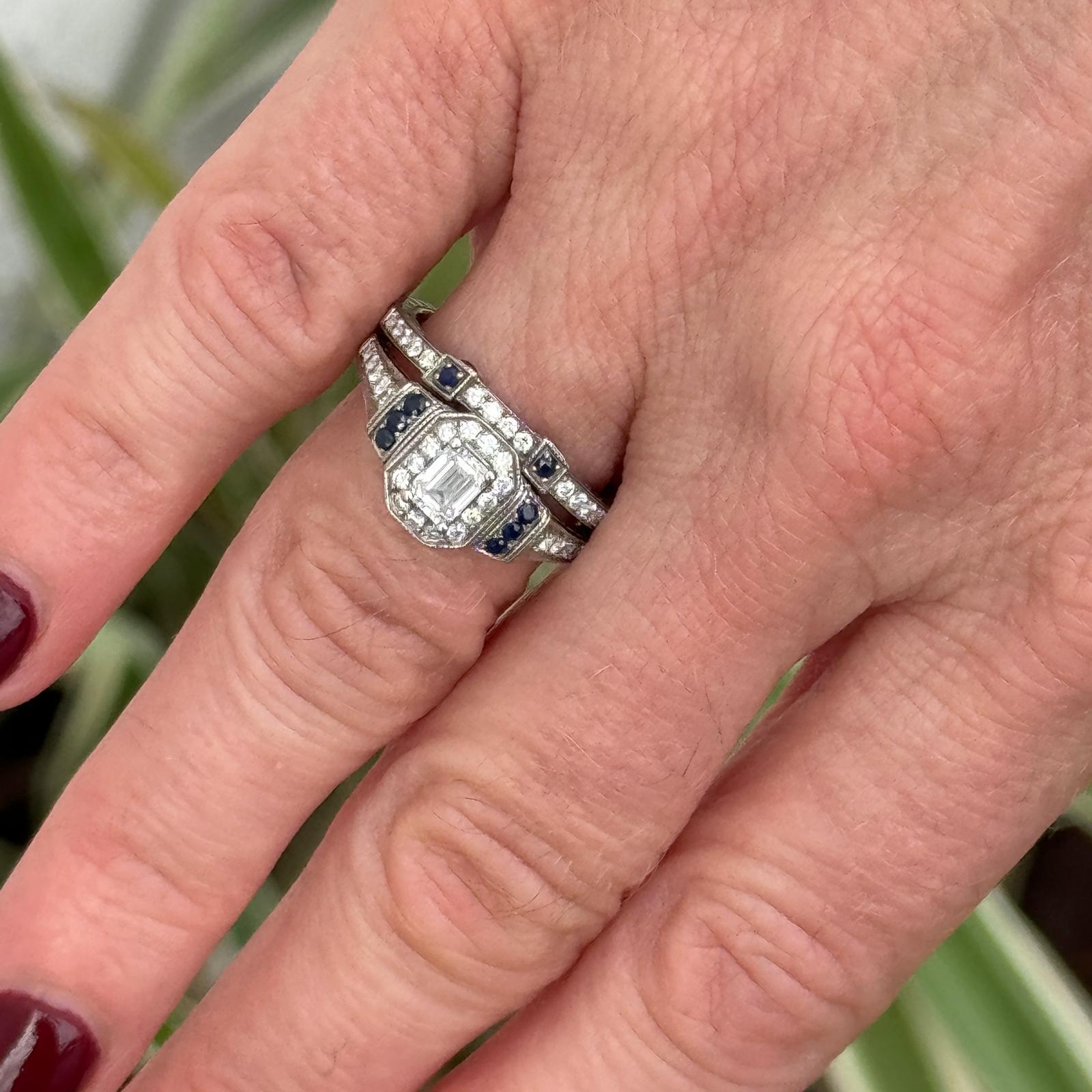 Emerald cut diamond engagement ring and bridal set crafted in 14 karat white gold. The engagement ring features an approximately .40 carat emerald cut diamond graded F color and SI1 clarity. The rings are set wtih 38 round brilliant cut diamonds