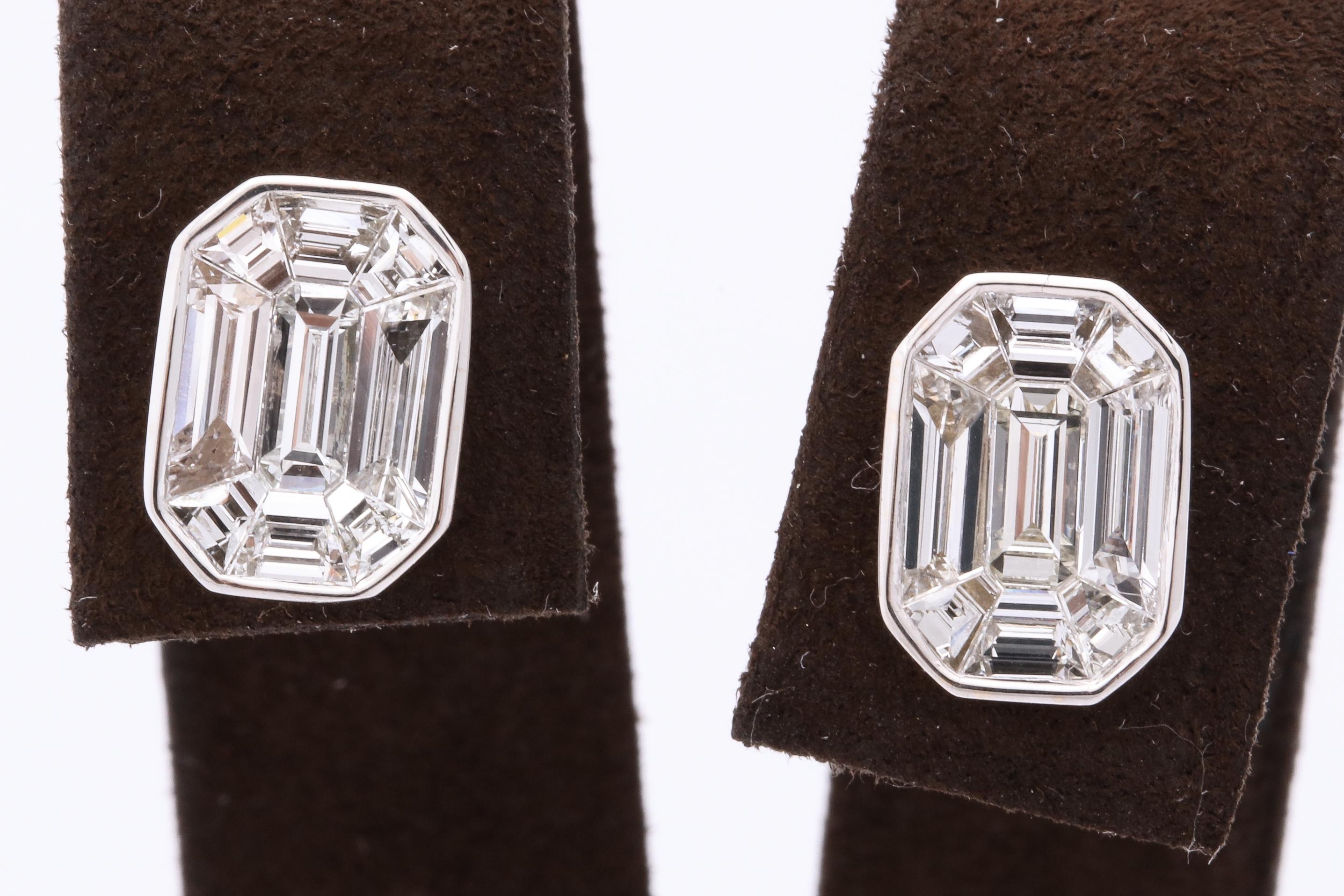 
An incredible pair of diamond studs!

3.33 carats of illusion set, special cut white diamonds set as an emerald cut. 

The studs look like they are over 5 carats each!!

18k white gold 

They measure 11.6 mm x 9.1 mm approximately. 

A FABULOUS