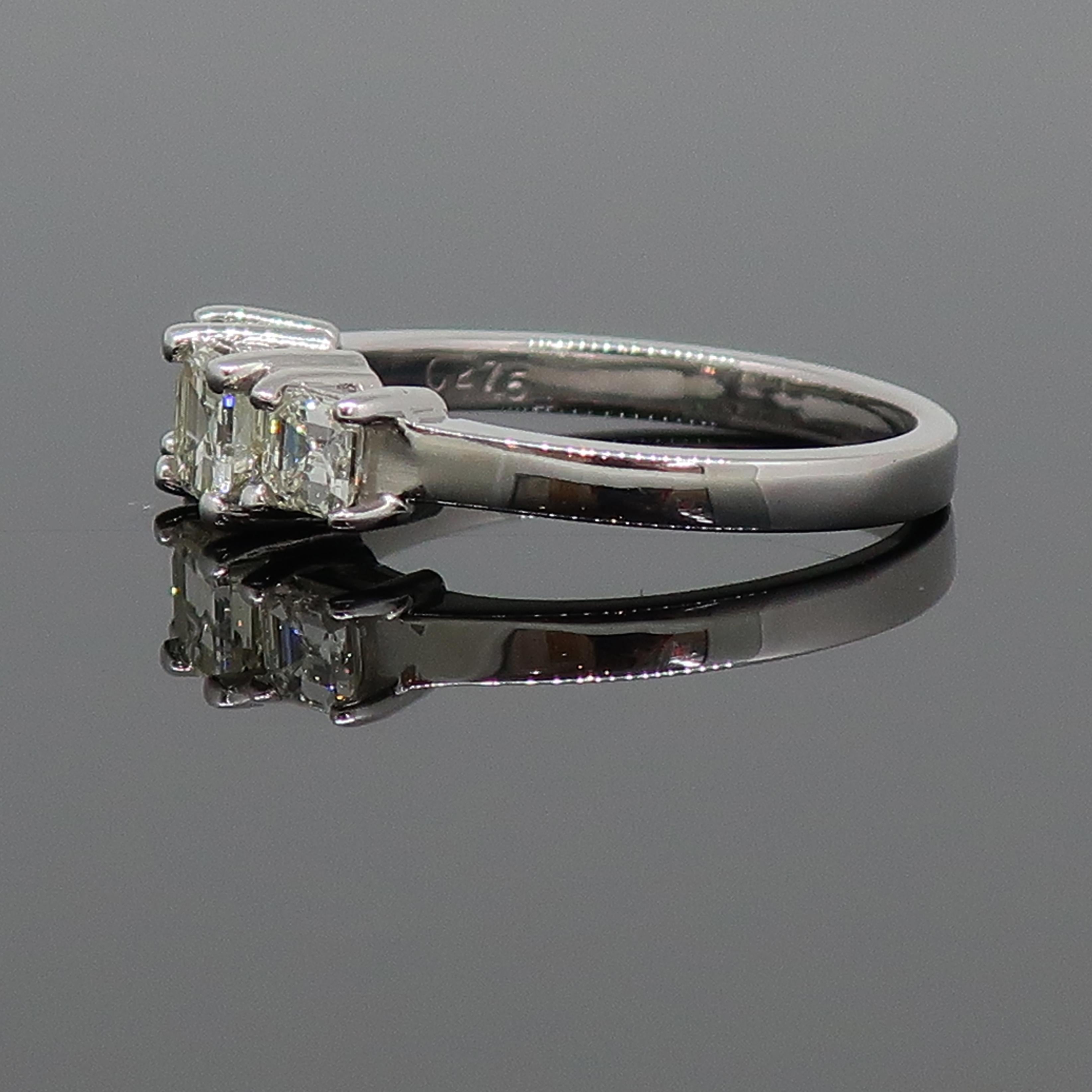 Modern Emerald Cut Diamond Three-Stone Ring 18 Karat White Gold 0.76ct For Sale