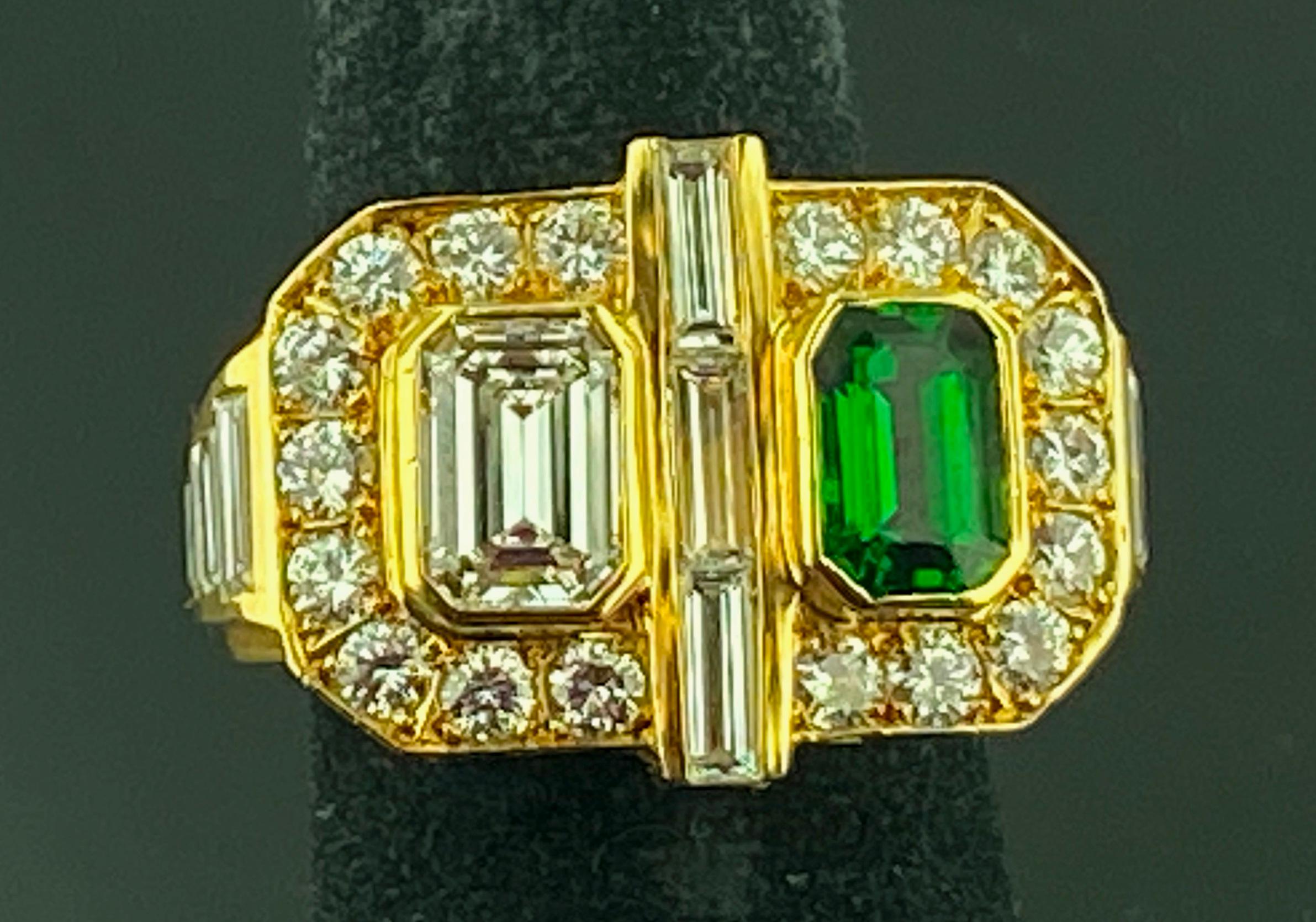 Set in 18 karat yellow gold, weighing 10 grams, is one 1.06 carat Emerald Cut Diamond and one 1.10 Emerald Cut Tsavorite with 15 baguette cut diamonds weighing 1.50 carats and 18 Round Brilliant Cut Diamonds weighing 0.90 carats.  Color: F-G,