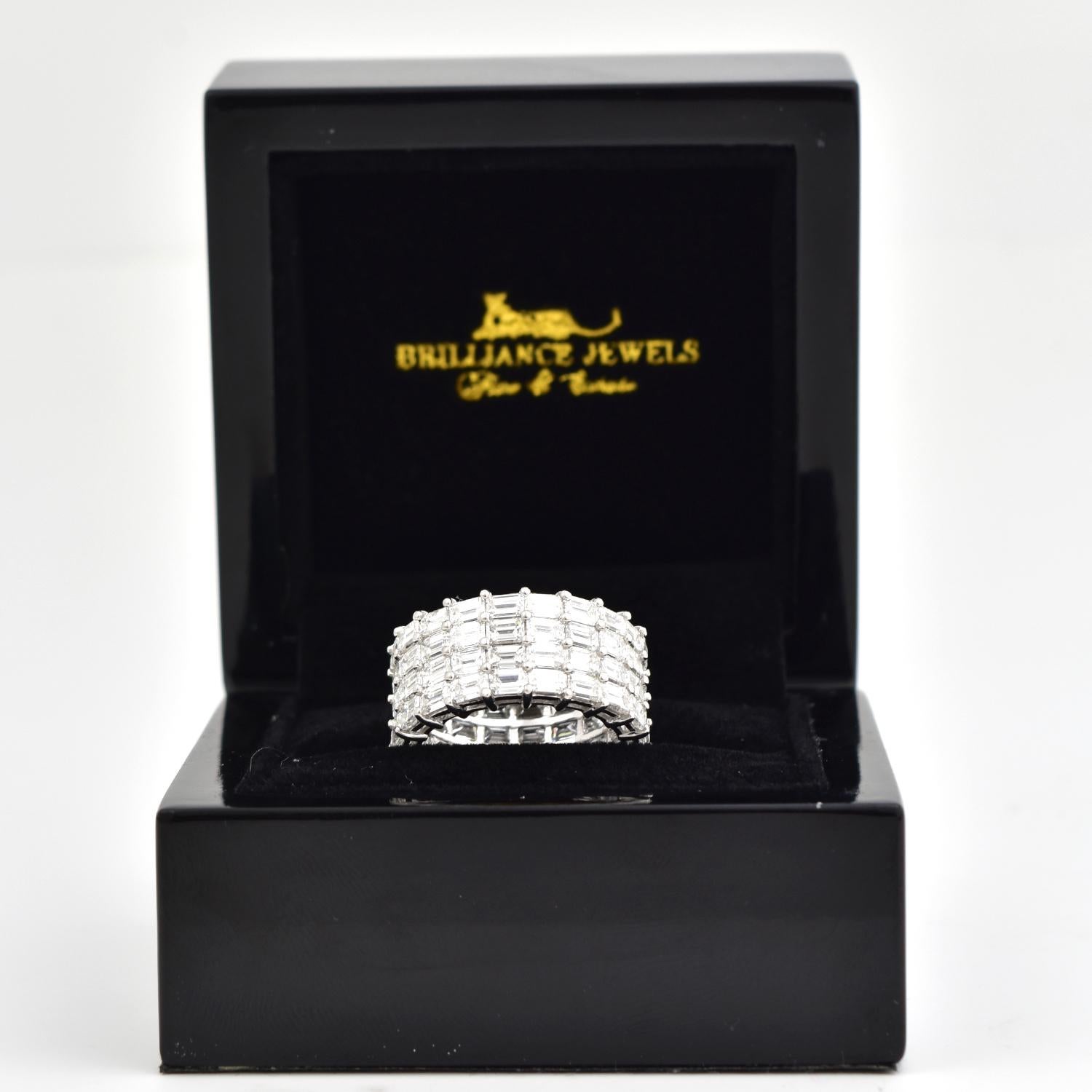 Style: Wide Eternity Band

Metal: White Gold 

Metal Purity: 18k

Stone: Baguette Cut 

Ring Size: 6

Total Carat Weight : Approx. 10 ct 

Diamond Color: E-F

Diamond Clarity: VS1​​​​​​​

Includes: 24 Month Brilliance Jewels Warranty 

Brilliance