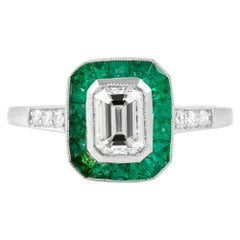 Emerald Cut Diamond with Emerald Around and Round Diamond Engagement Ring