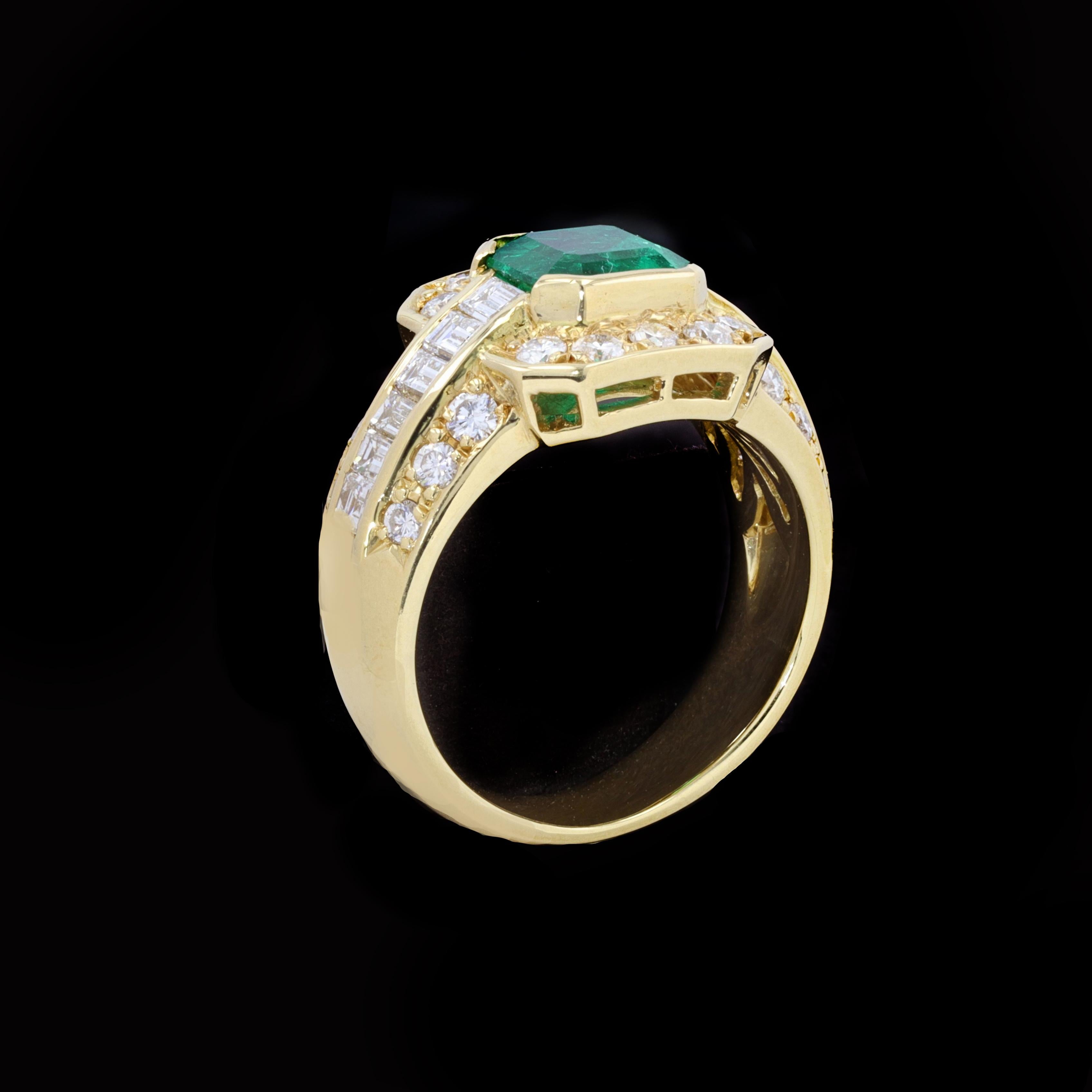 Centered with a lovely emerald cut Colombian emerald, and surrounded by shimmering diamonds, this 18K yellow gold estate ring is a perfect combination of timeless fashion and style. The emerald is accentuated by sparkling round and baguette cut