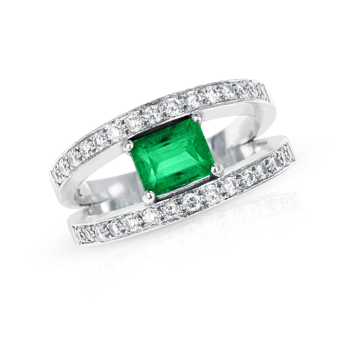 A fine Emerald-Cut Emerald and Diamond Double Row Ring made in 18 Karat White Gold. The Ring Size is US 10. The total weight of the ring is 11.51 grams.