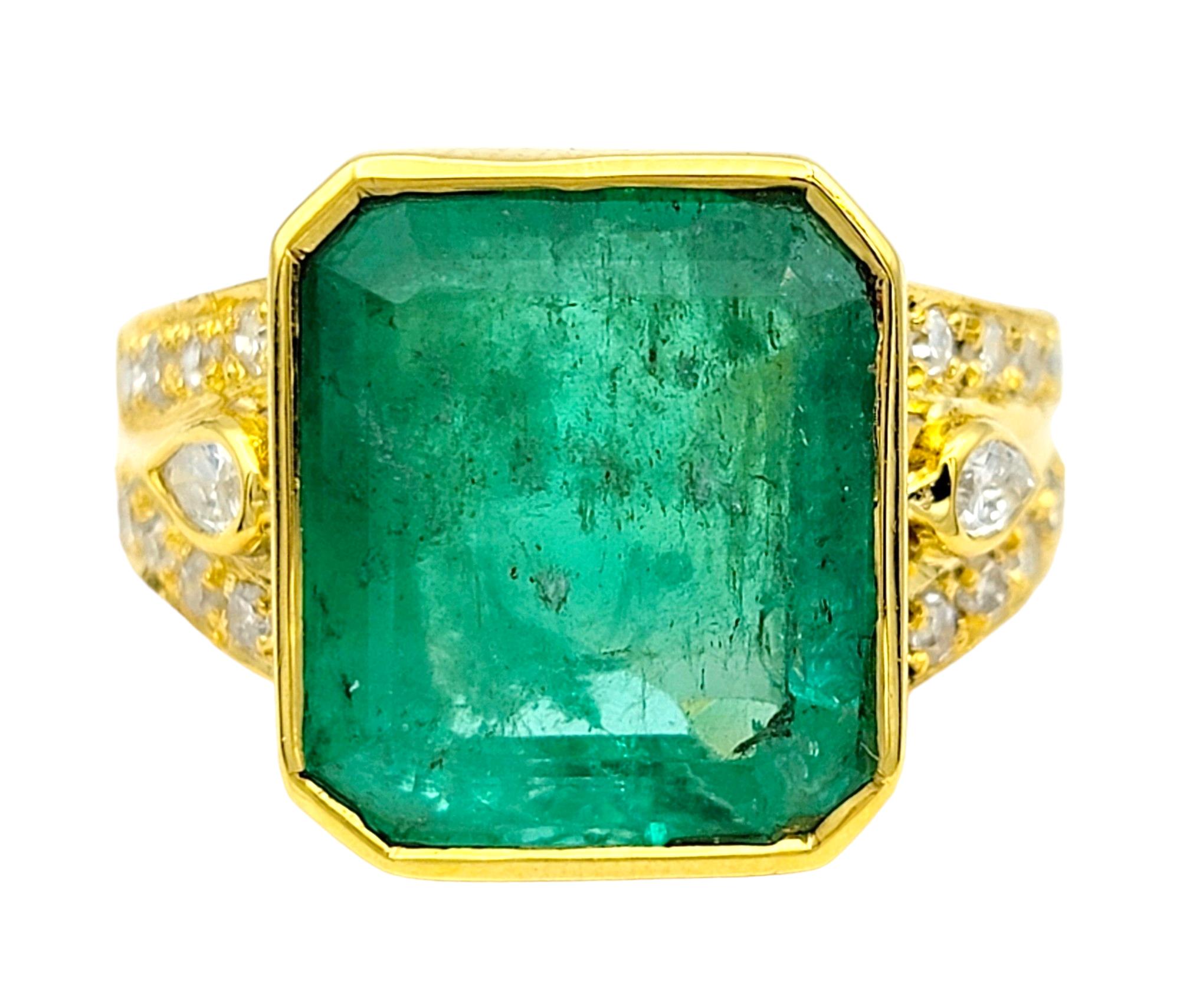 Ring Size: 7.5

This stunning cocktail ring exudes timeless elegance and sophistication with its luscious emerald centerpiece set in luxurious 18 karat yellow gold. The emerald, with its captivating emerald-cut, takes center stage, radiating a deep