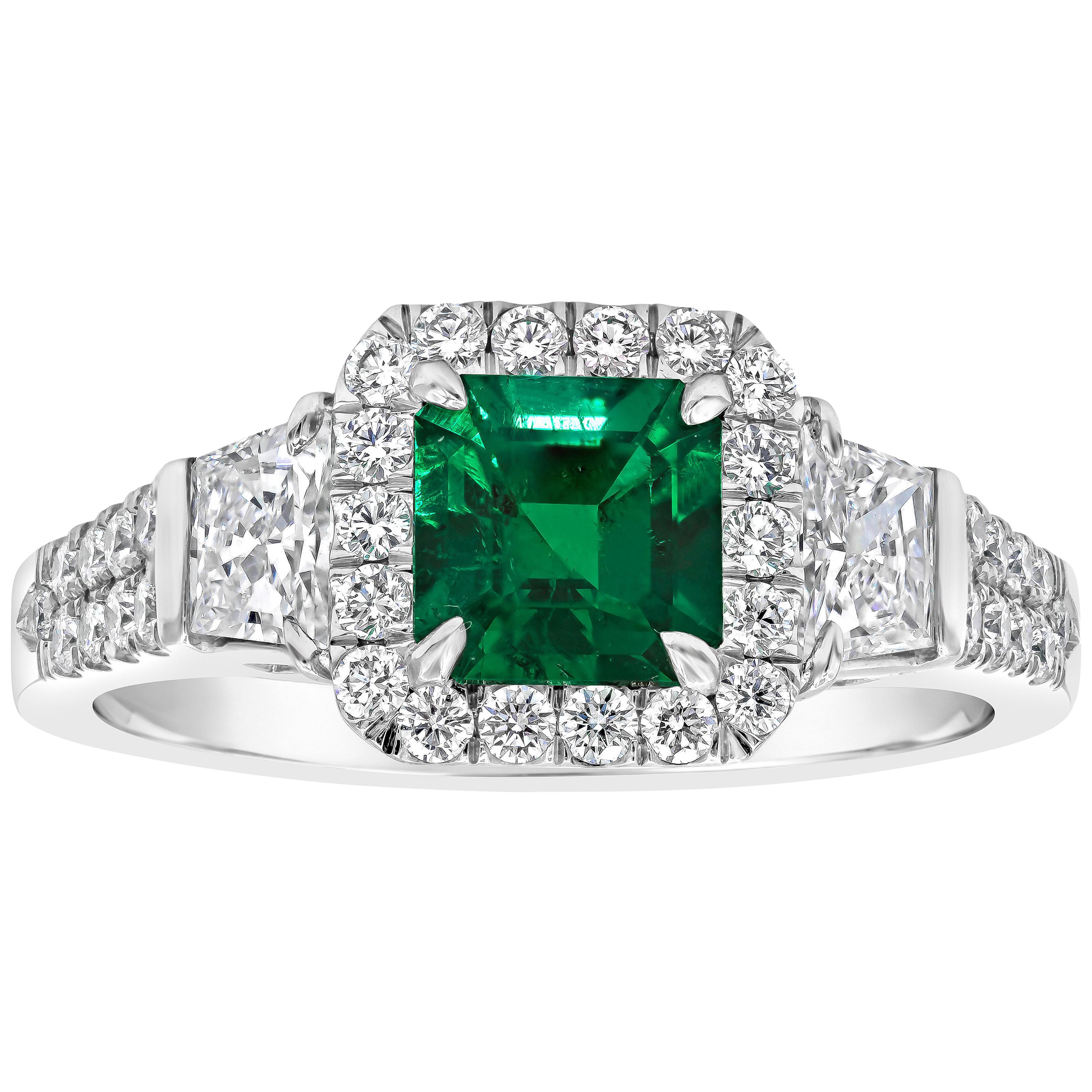 Emerald Cut Emerald and Diamond Three-Stone Halo Engagement Ring
