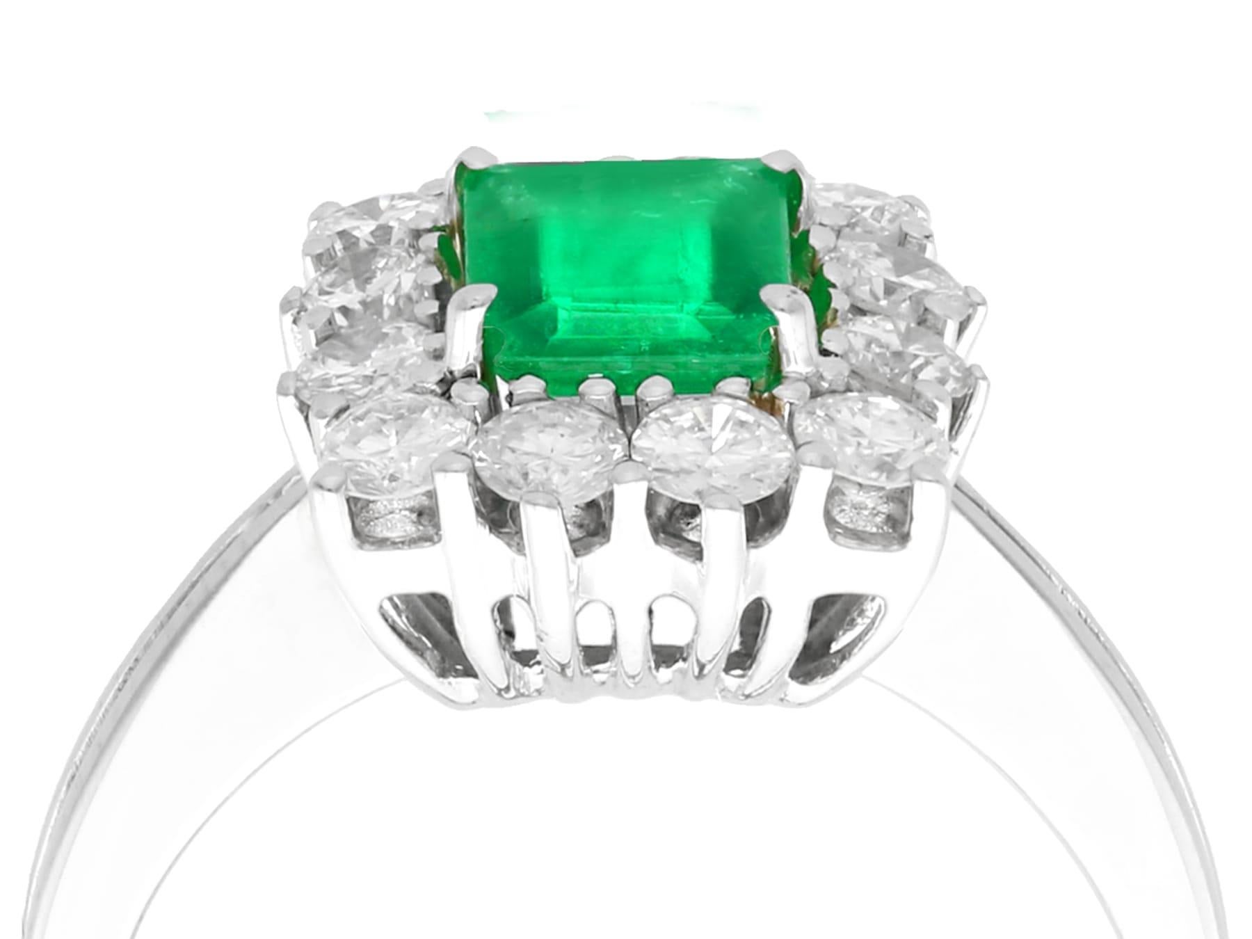 An impressive vintage 0.62 carat natural emerald and 0.84 carat diamond, 15 karat white gold vintage cocktail ring; an addition to our vintage jewelry collections.

This impressive vintage emerald cut Emerald and diamond cluster ring has been