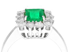 Emerald Cut Emerald and Diamond White Gold Cluster Ring