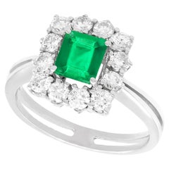 Emerald Cut Emerald and Diamond White Gold Cluster Ring