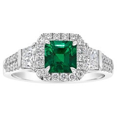 Emerald Cut Emerald and Diamonds Three-Stone Engagement Ring