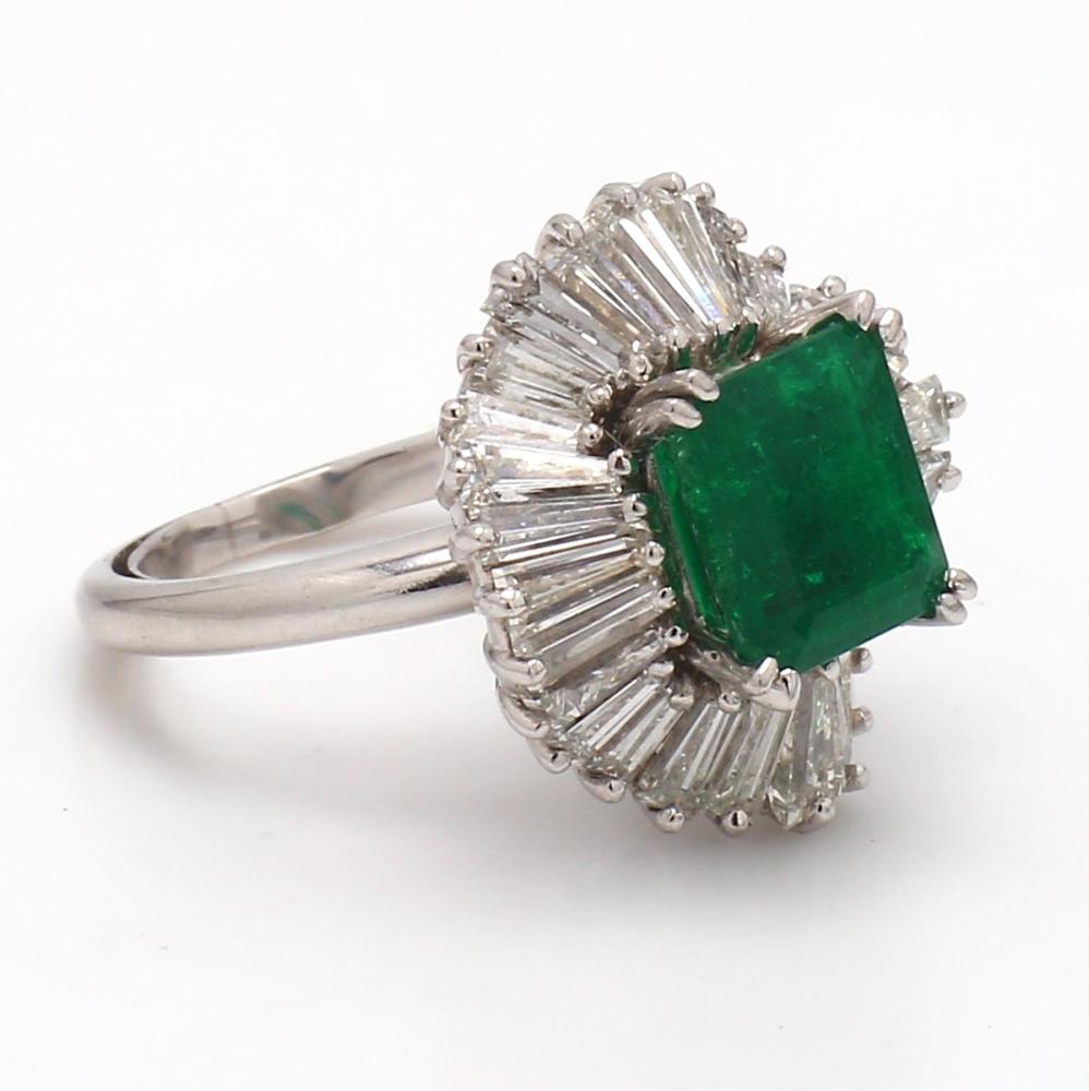 Platinum Ring with Emerald and Baguette Cut Diamonds

This exquisite platinum ring features a striking 2.0-carat emerald cut emerald, radiating a deep green hue. Surrounding the central stone are 3.5 carats of baguette cut diamonds, each with a