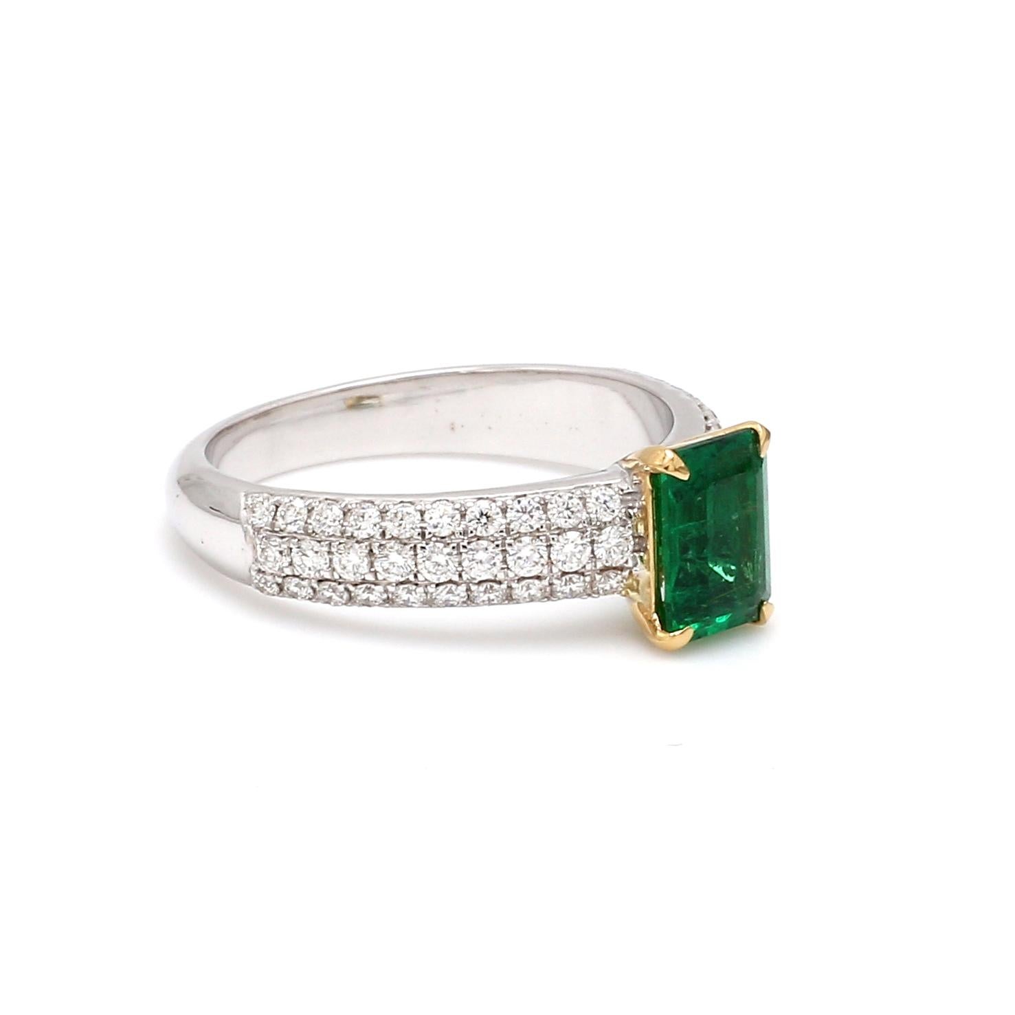 A Beautiful Handcrafted Ring in 18 Karat White Gold with Natural Emerald Cut Emerald Center and Diamonds on Shank. A perfect Ring for occasion

Natural Center Emerald Details
Pieces : 1 Pieces Emerald Cut 
Weight : 0.84 Carat 
AAA Quality