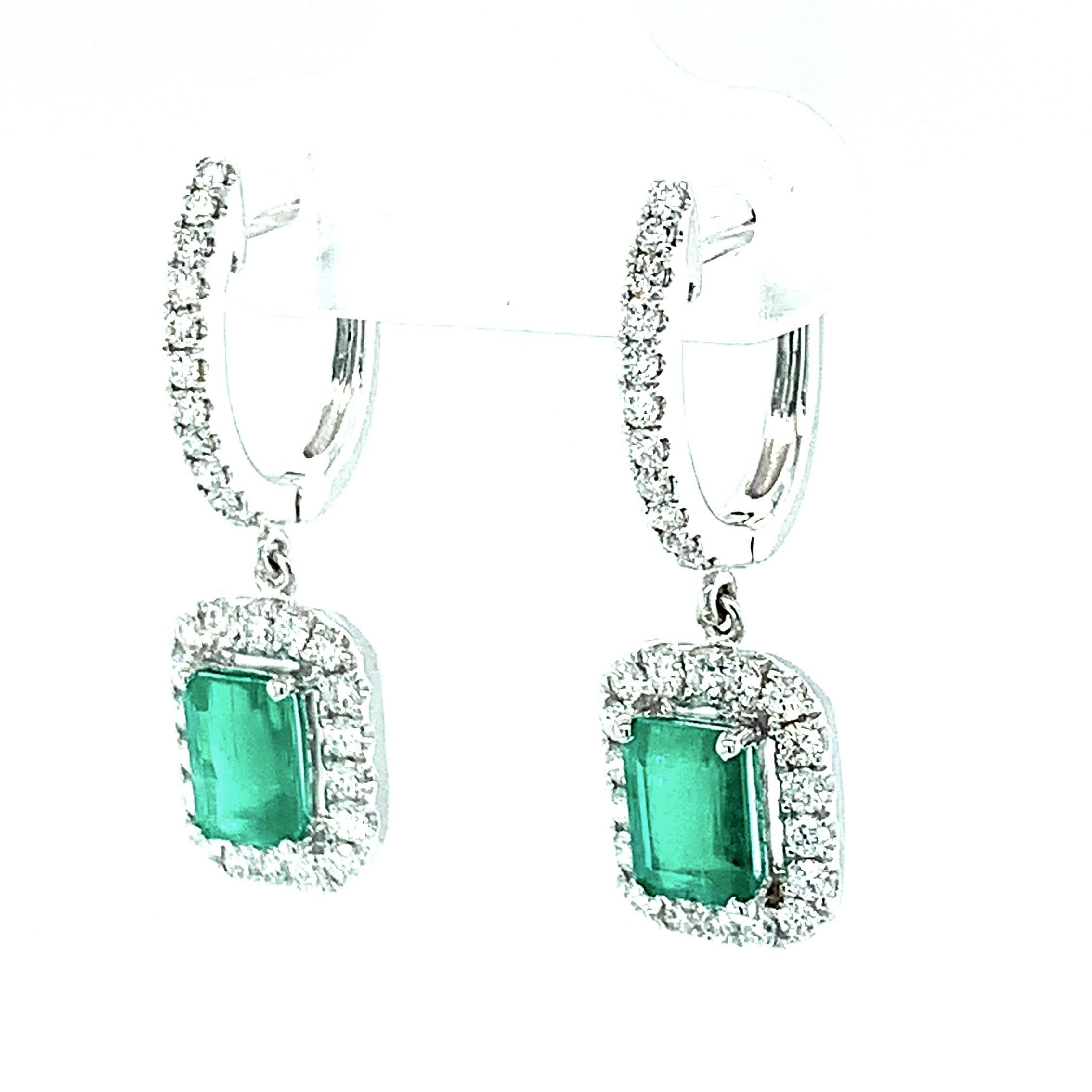 Emerald Cut Emerald & Diamond Halo White Gold Dangle Post Drop Dangle Earrings  In New Condition In Los Angeles, CA