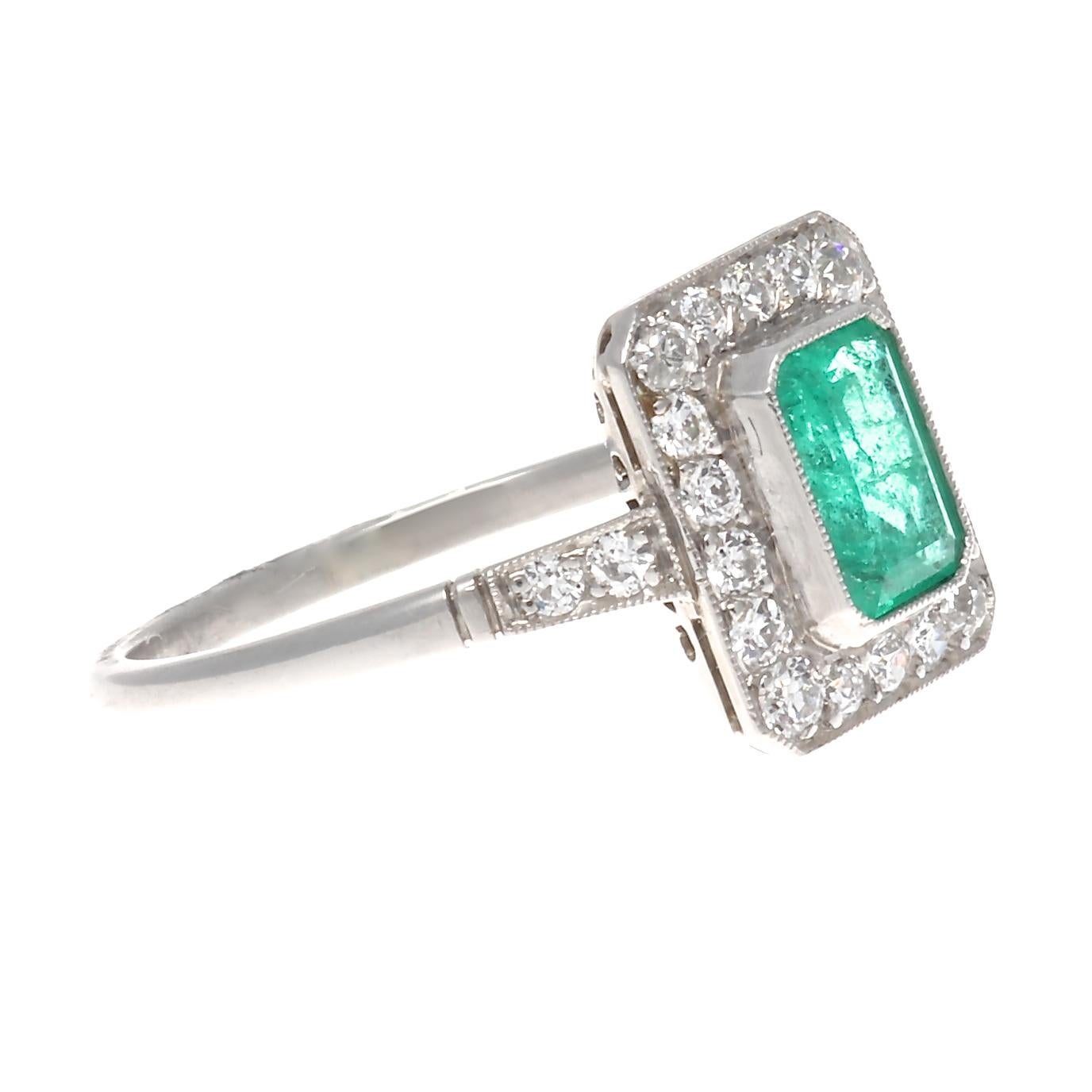 Inspired by the finest era of jewelry. Art Deco is a style of visual arts combining architecture and design that first originated in France before the commencement of the first world war. Featuring a 0.64 carat forest green emerald that is perfectly