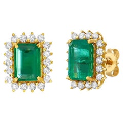 Emerald Cut Emerald With Diamond Halo Earrings (4.50 ct.) in 14K Gold