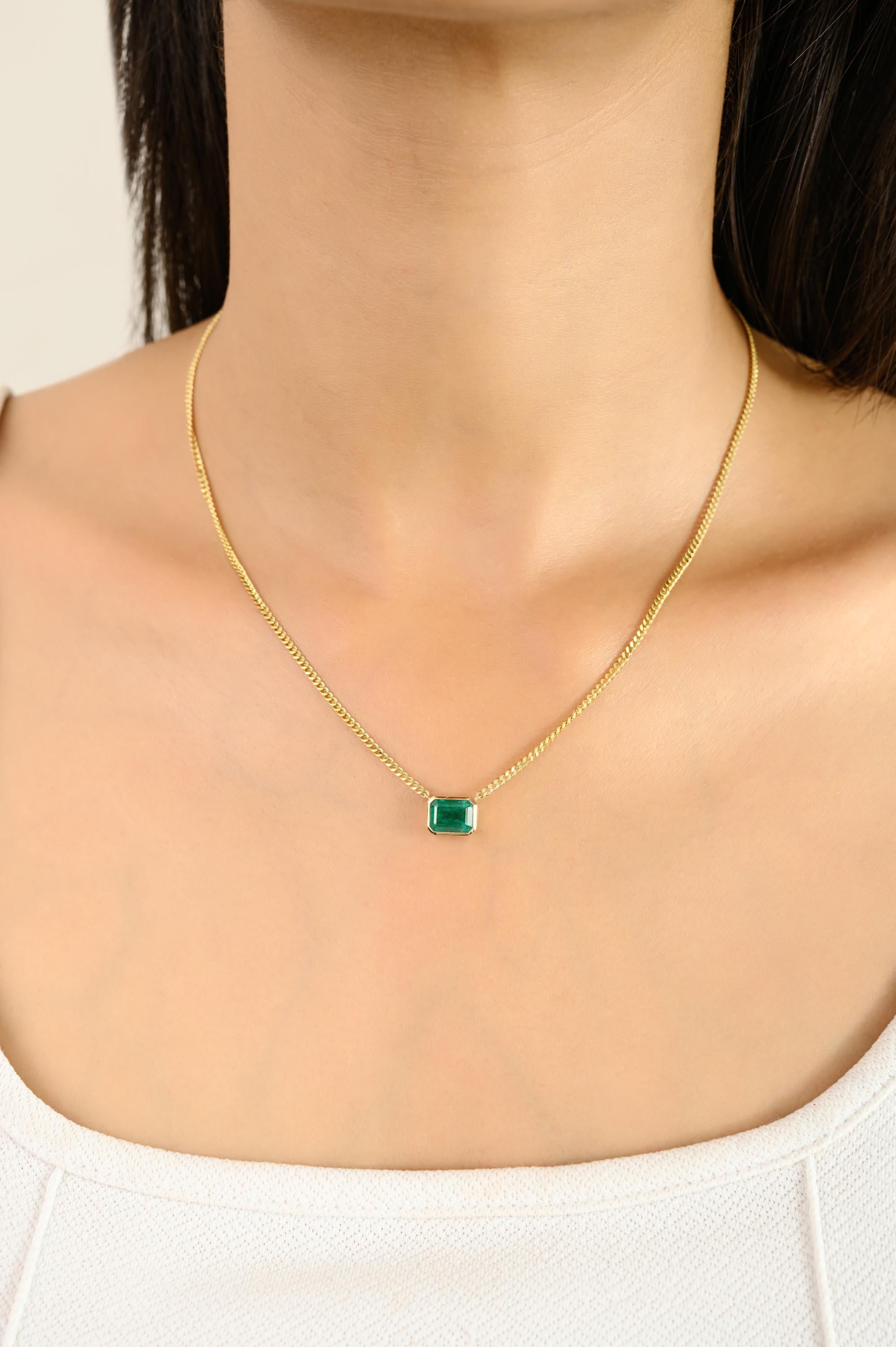 This elegant necklace highlights a 1.22 carat emerald-cut green emerald in a sleek bezel setting, suspended from a classic 14k yellow gold curb chain. The vivid emerald radiates timeless beauty, symbolizing love and prosperity. A versatile piece of