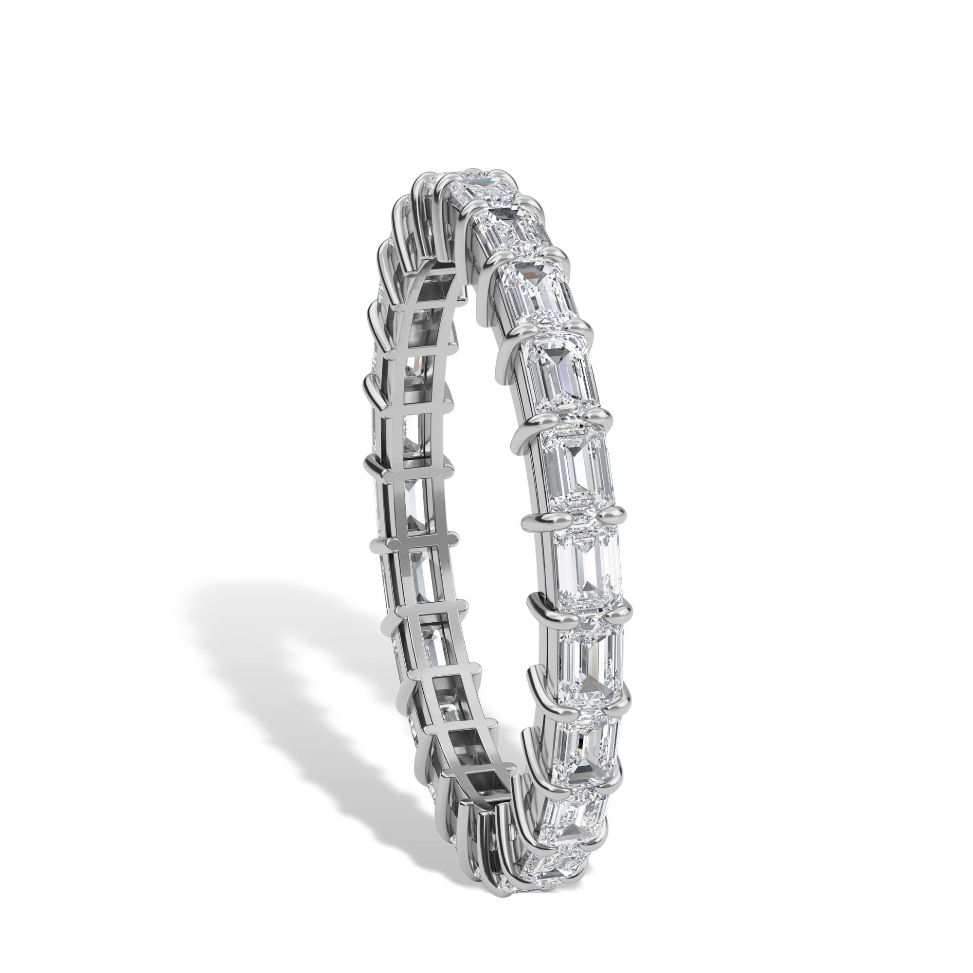 This ring has Emerald cut diamonds that are set horizontal. 
The ring has 24 diamonds with a total carat weight of 1.34.
The diamonds are F Color VS Clarity. The ring is a finger size 6.25 and is set in platinum.
This ring is the perfect ring that