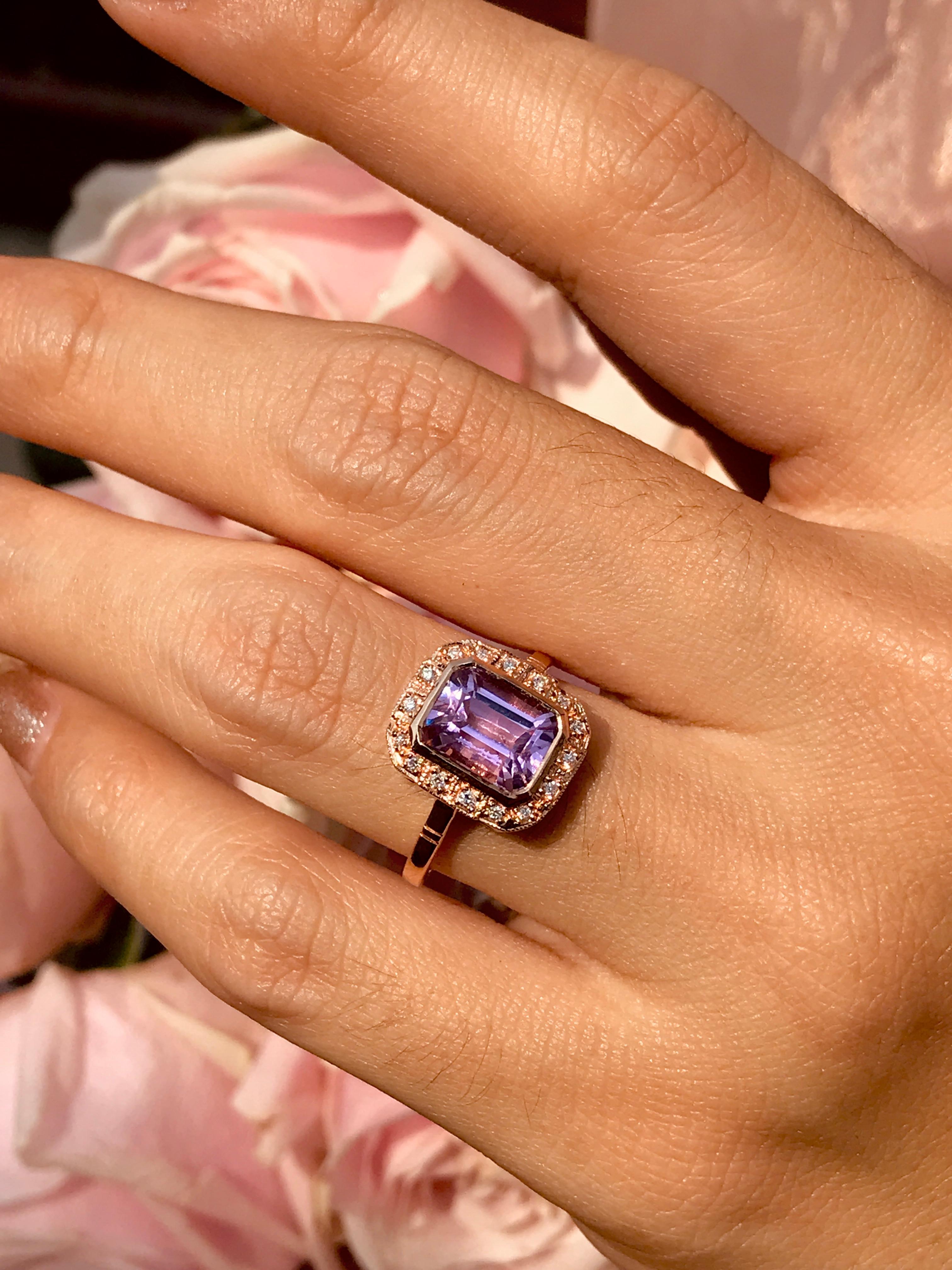 A gorgeous emerald cut kunzite is presented in classic Art Deco style. The glorious gemstone radiates from within a sparkling halo of bright round brilliant cut diamonds all set in 18k rose gold.

Ring Information
Style: Art Deco
Metal: 18K Rose