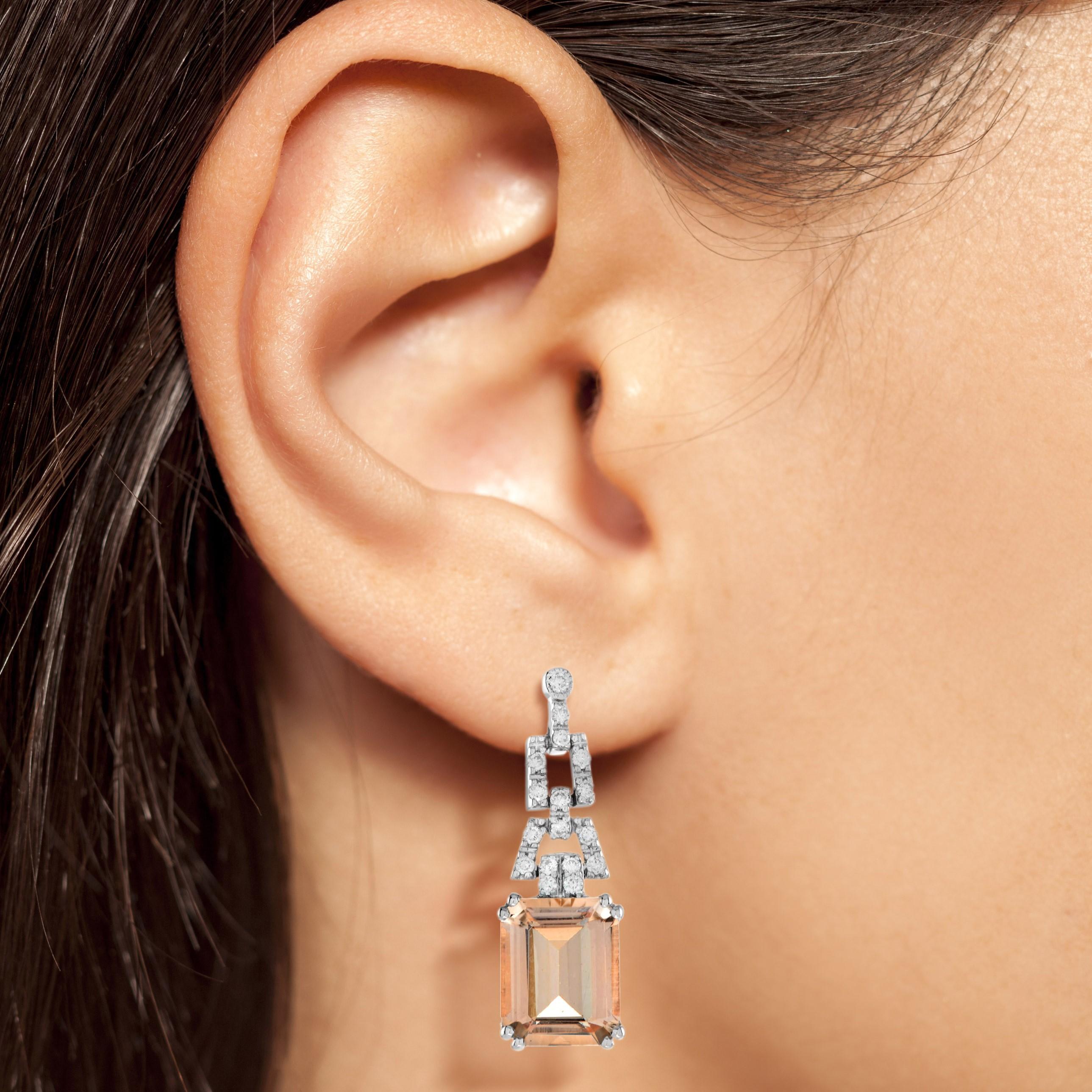 Express yourself with these insanely stylish, stunningly detail earrings with emerald cut peach hued morganite and diamonds in 14k white gold. Match them with your favorite outfit to complete your look.

Earrings Information
Style: Vintage
Metal: