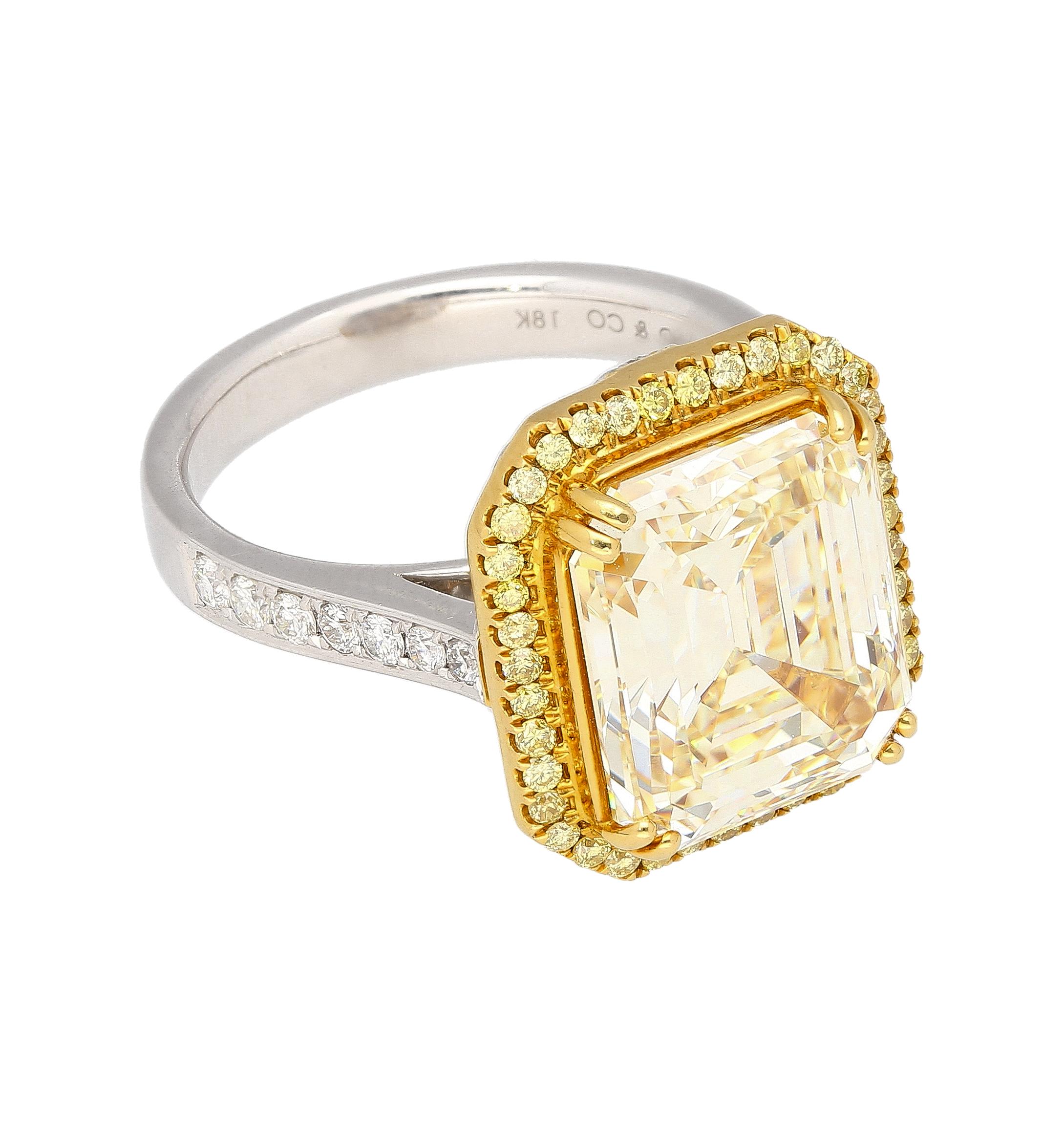 Women's Emerald Cut Natural 7.25 Carat Fancy Light Yellow Diamond & Diamond Halo Ring For Sale