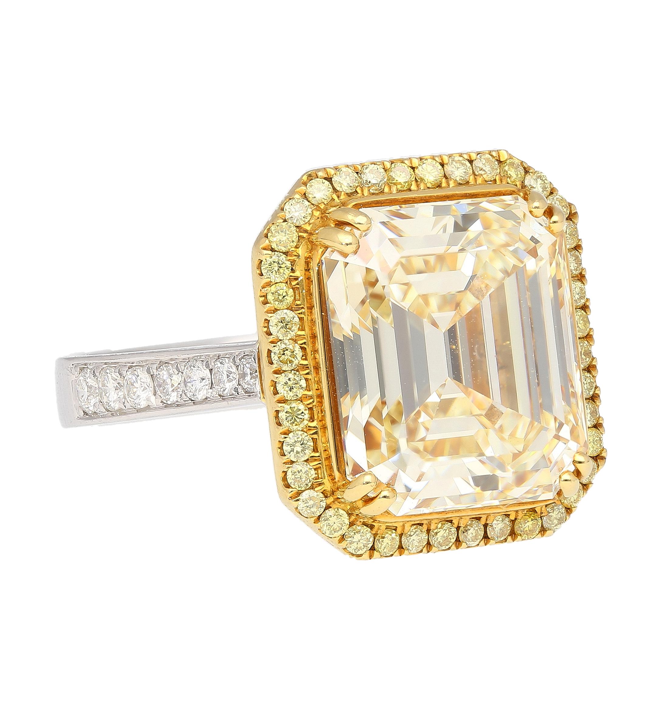Emerald Cut Natural 7.25 Carat Fancy Light Yellow Diamond & Diamond Halo Ring For Sale 1