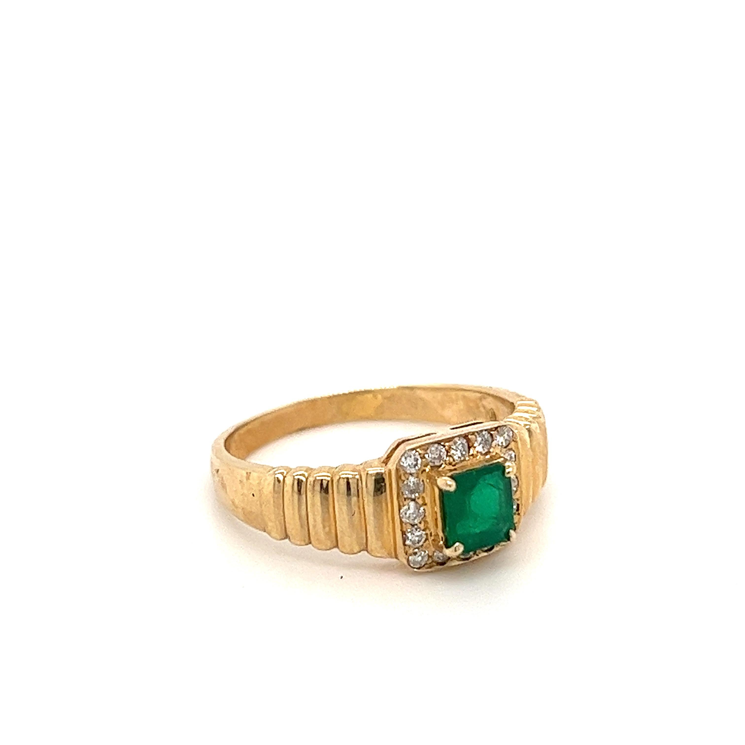 Cute and dainty natural emerald set with natural round cut diamond halo in 18k yellow gold ring. The Emerald is set in a 4-prong mounting with a tension set diamond halo. Hypoallergenic, waterproof, and tarnish-proof. Ideal for daily wear.