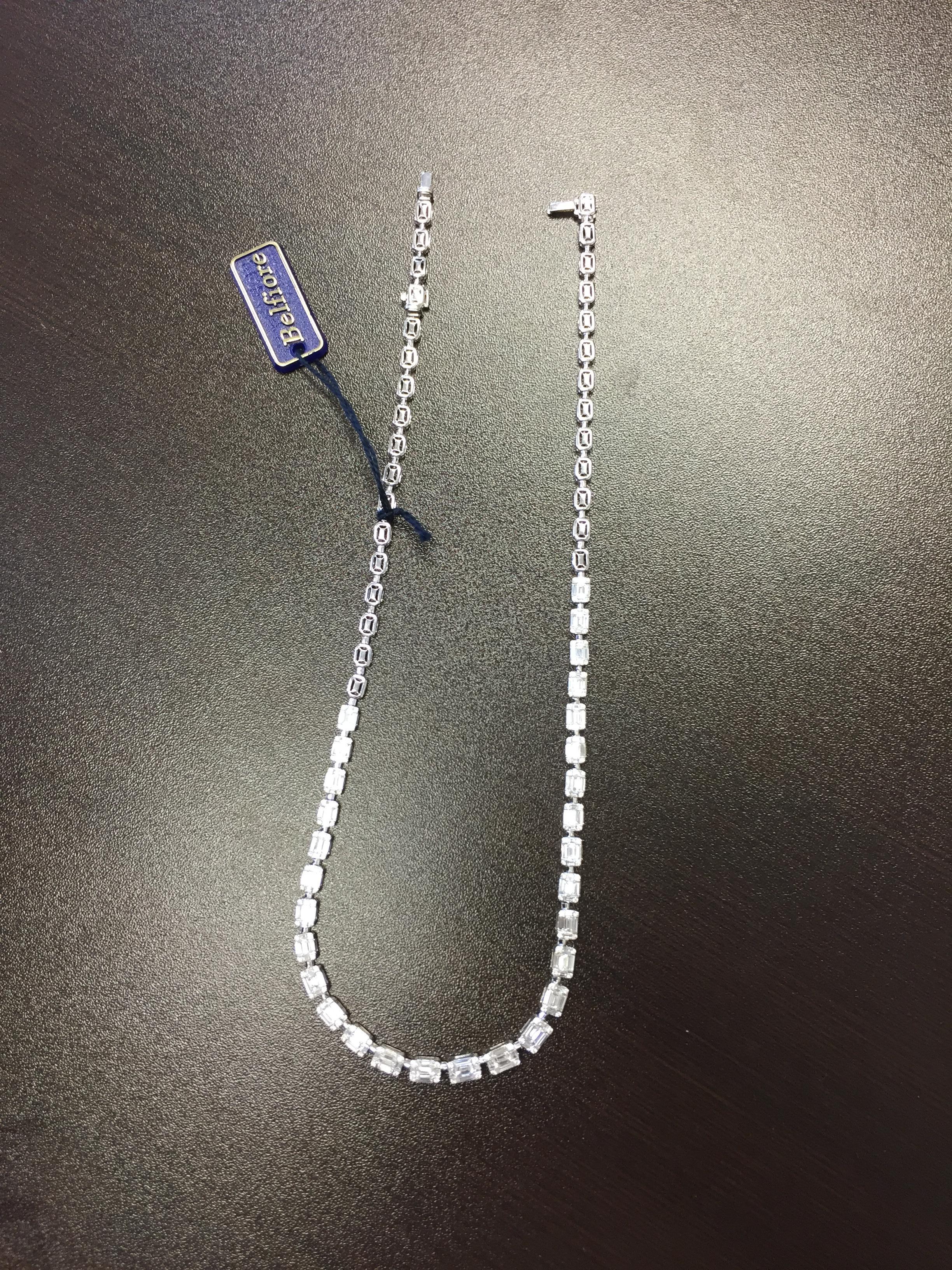 This necklace is set with a mosaic of stones that create the illusion of a single emerald cut stone. 
The necklace is set in 18K white gold. It is 17 inches long, the total weight is 8.03 carats. The color of the stones are F. The clarity VS1-VS2.