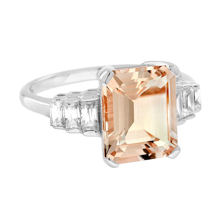 The sweet of authentic morganite looks lovely when paired, and the baguette diamonds total 0.19 carats. Feel like a star as you wear this ring, with a glittering morganite stone and six sparkling diamonds! 14K White Gold. 
Ring Information
Style: