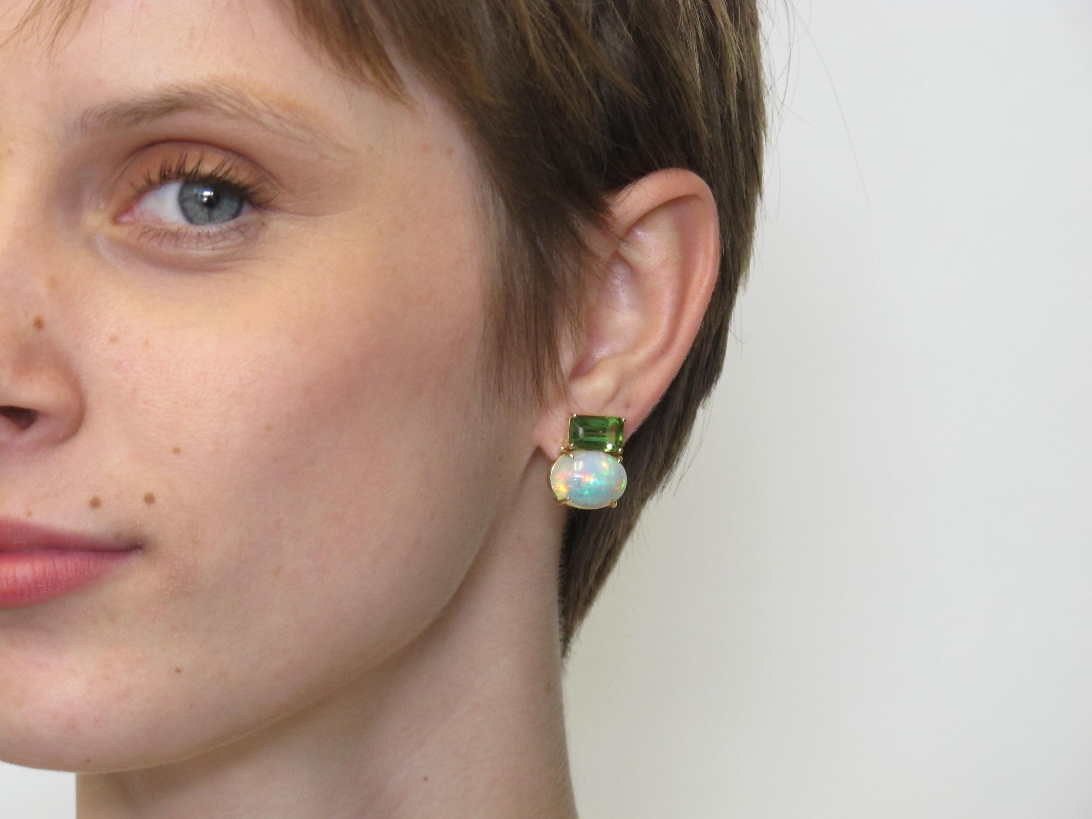 Opals are nature's rainbow gemstones due to their unique play with light. Why not have some of that playfulness on your ears? These bold and unique opal and peridot earrings make a quiet statement when you wear them. The combination of the two