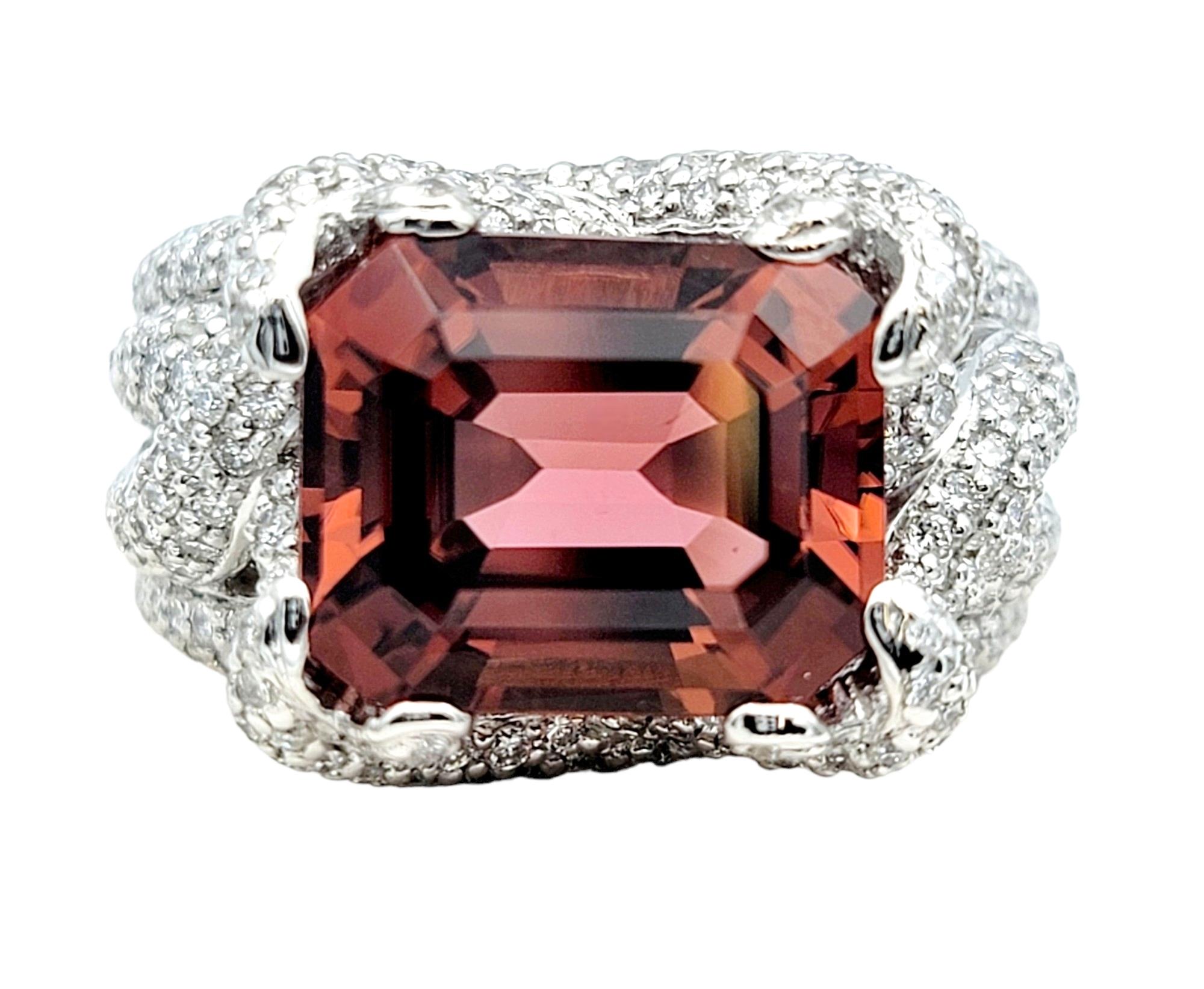 Ring size: 6

So pretty in pink! This stunning and scintillating ring features an overlapping multi-row diamond encrusted band surrounding a sensational 5.75 carat pink tourmaline stone. It is breathtaking, ultra feminine and simply gorgeous. 

This