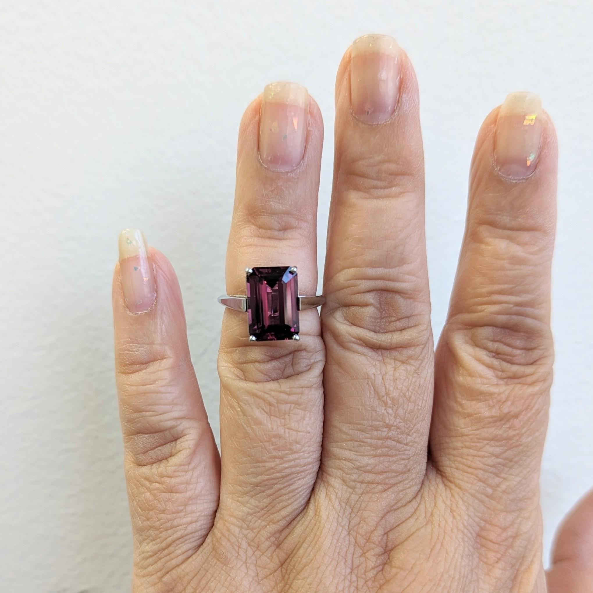 Beautiful 5.44 ct. purple spinel emerald cut in a handmade platinum ring.  Ring size 5.5.  