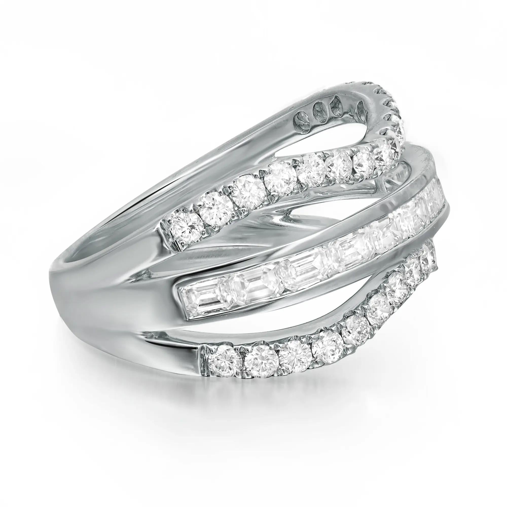 Shimmering and elegant, this diamond band ring is perfect for any occasion. Crafted in lustrous 18K white gold. This beautiful ring is adorned with channel set emerald cut diamonds in the center with two curved rows of round brilliant cut diamonds.