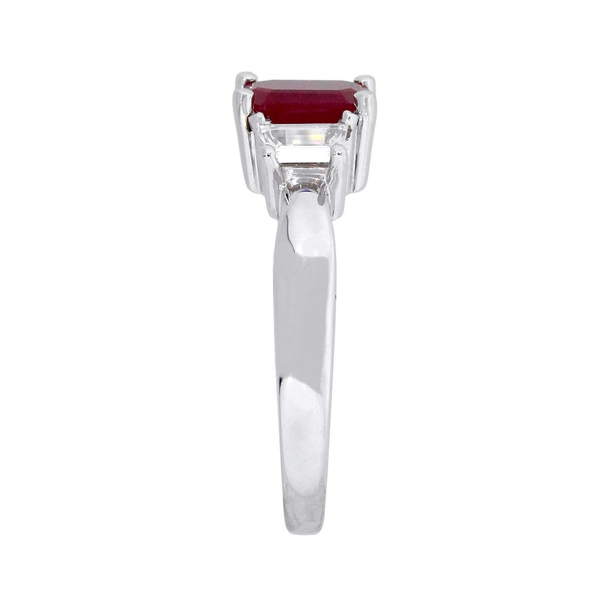 Material: 18k White Gold
Ruby Details: Approx. 1.20ct of emerald cut ruby.
Adjacent Diamond Details: Approx. 0.37ctw trapezoid cut diamonds. Diamonds are G/H in color and VVS in clarity.
Ring Size: 7
Total Weight: 5.1g (3.3dwt)
Ring Measurements: