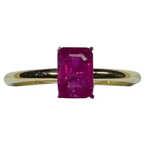 Emerald cut ruby engagement ring 18k yellow gold