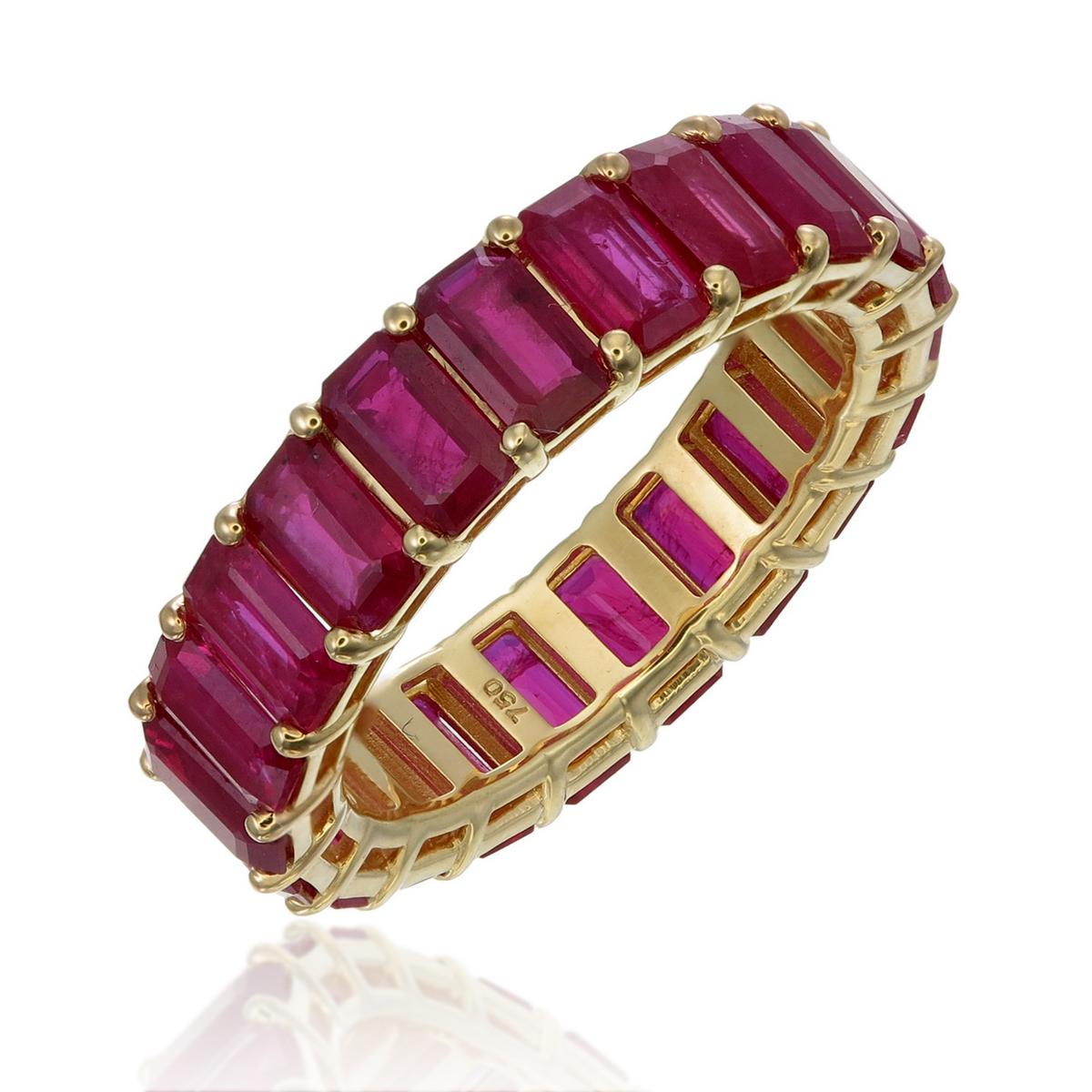 Elevate your jewelry collection with this stunning emerald cut ruby eternity band, featuring 10.50 carats of vibrant rubies set in luxurious 18kt gold. This exquisite piece not only showcases the rich, deep red hues of the rubies but is also adorned