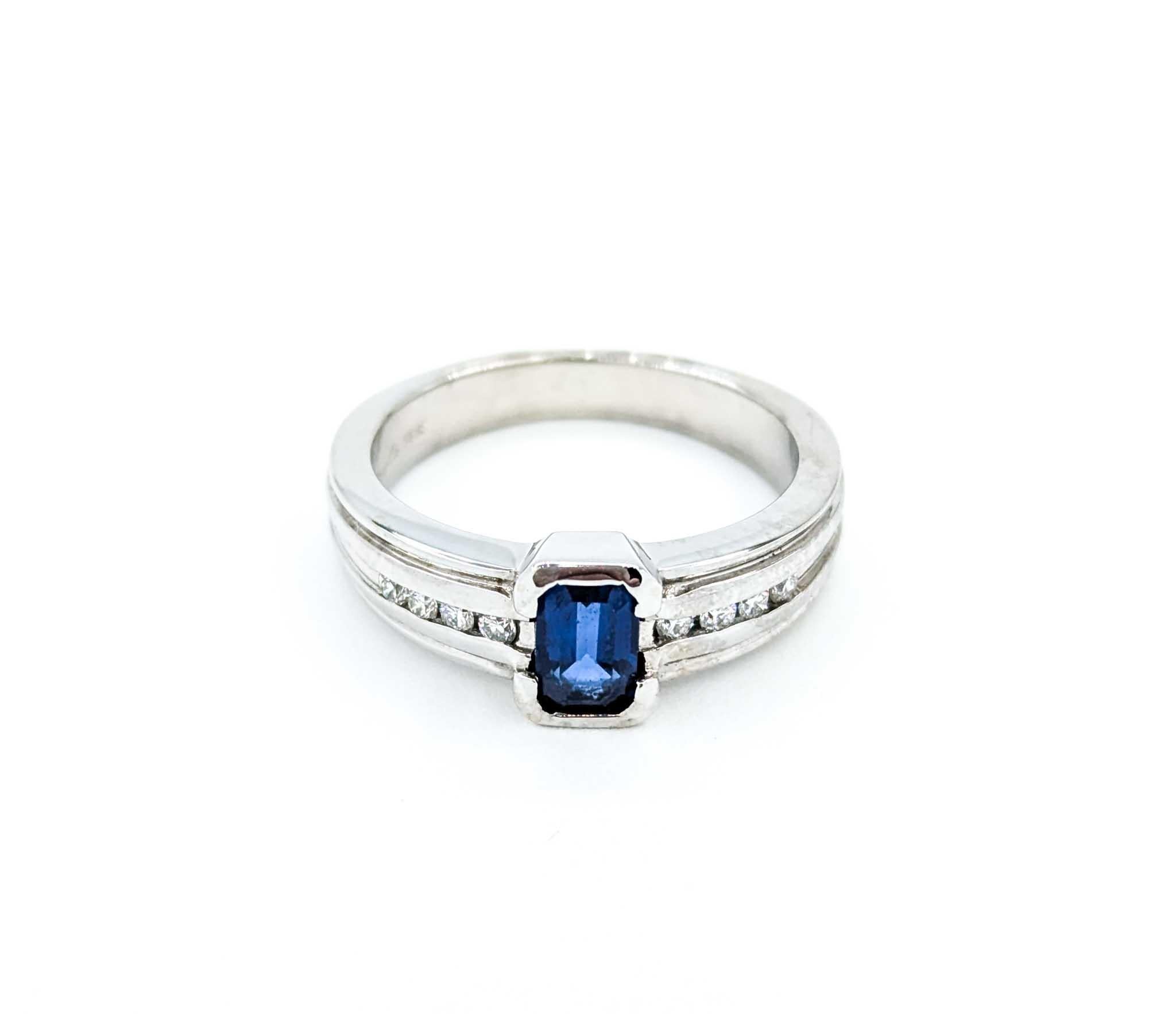 Emerald Cut Sapphire Ring with Channel Set Diamonds in White Gold For Sale 6