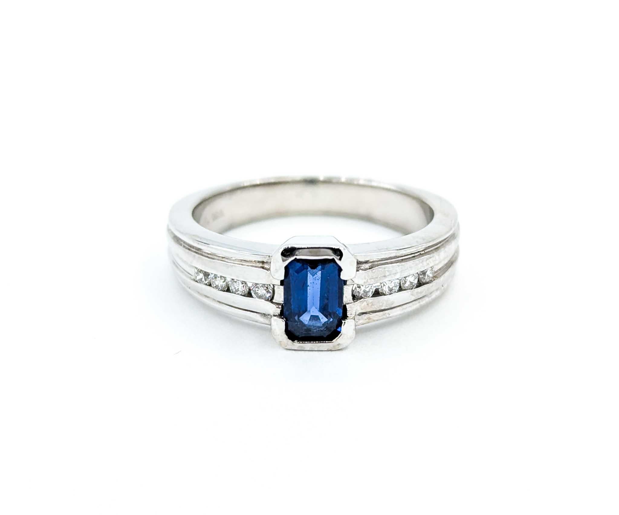 Emerald Cut Sapphire Ring with Channel Set Diamonds in White Gold For Sale 7