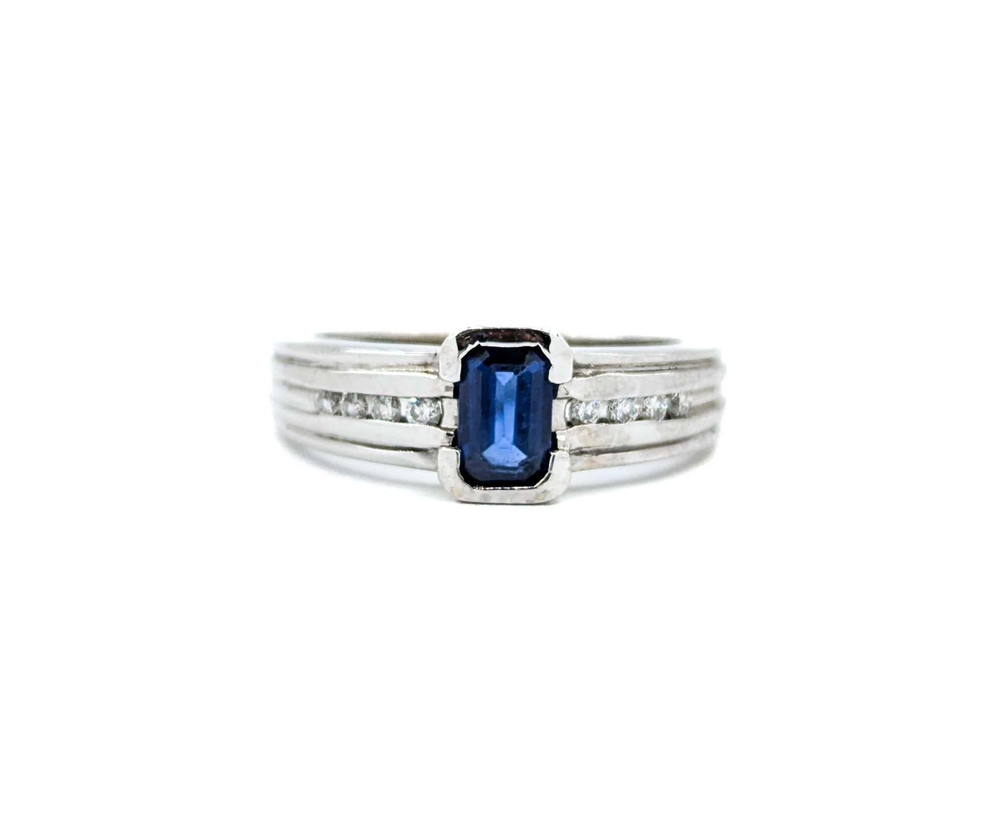 Emerald Cut Sapphire Ring with Channel Set Diamonds in White Gold For Sale 8