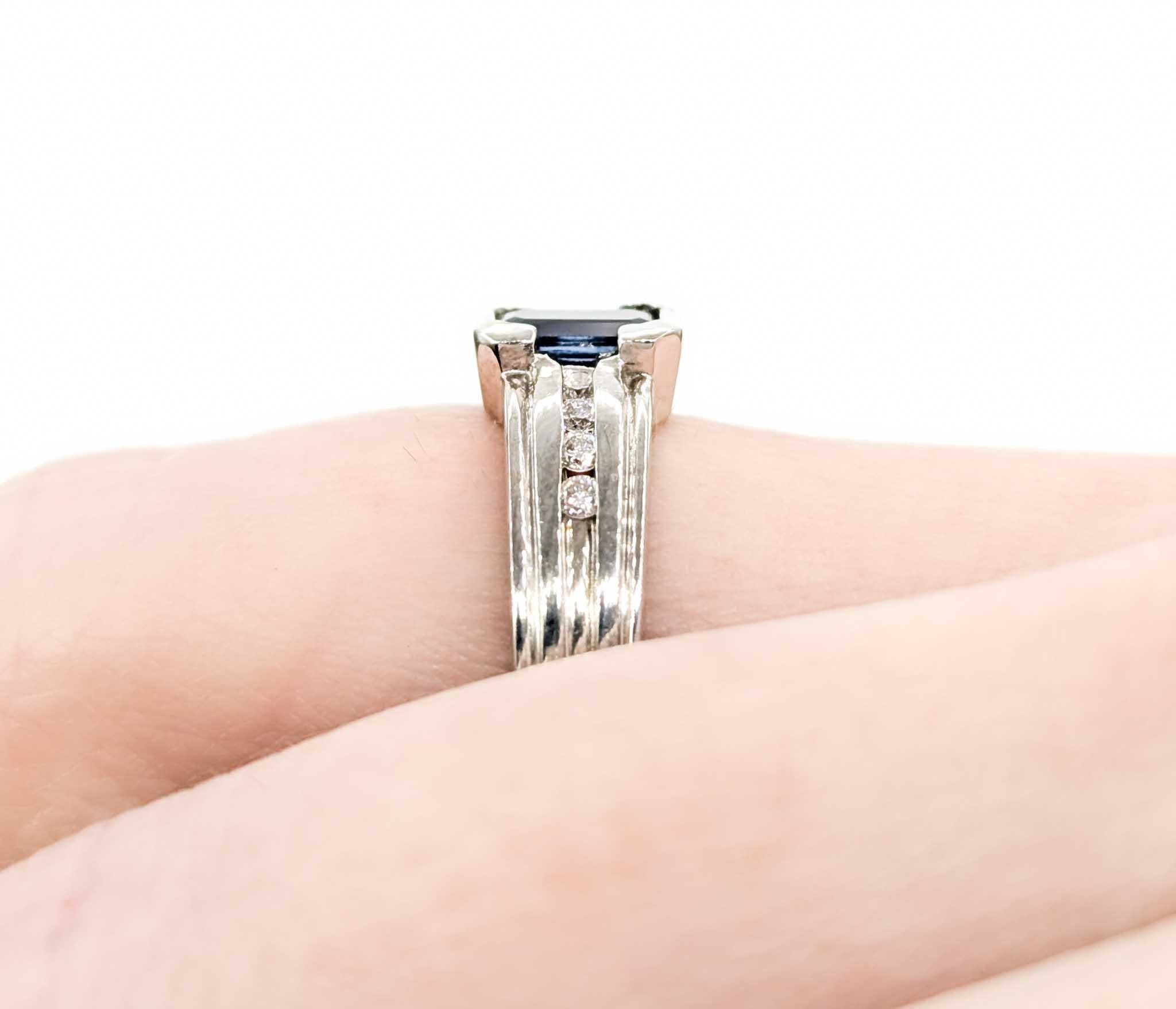 Emerald Cut Sapphire Ring with Channel Set Diamonds in White Gold In Excellent Condition For Sale In Bloomington, MN
