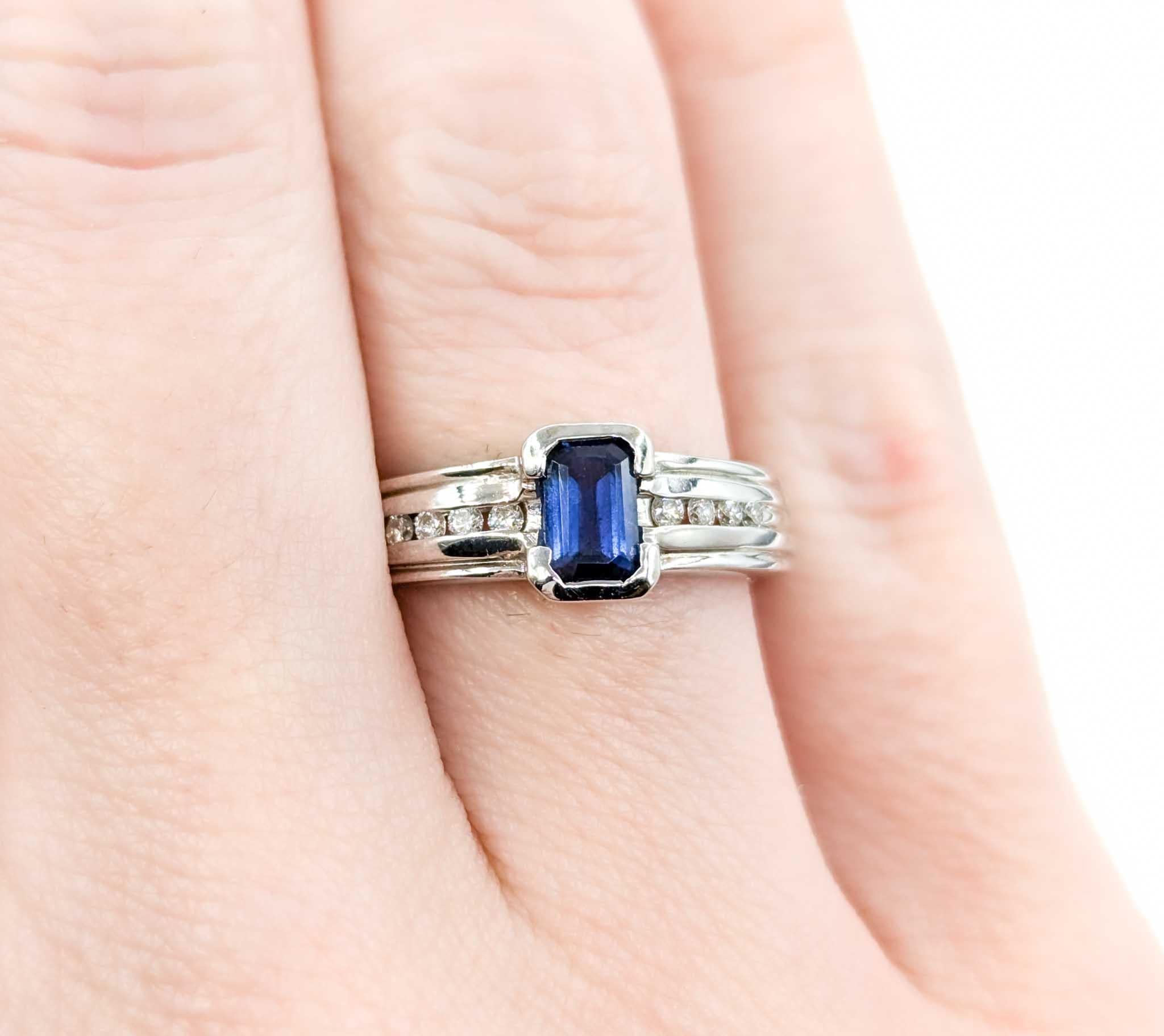 Emerald Cut Sapphire Ring with Channel Set Diamonds in White Gold For Sale 1