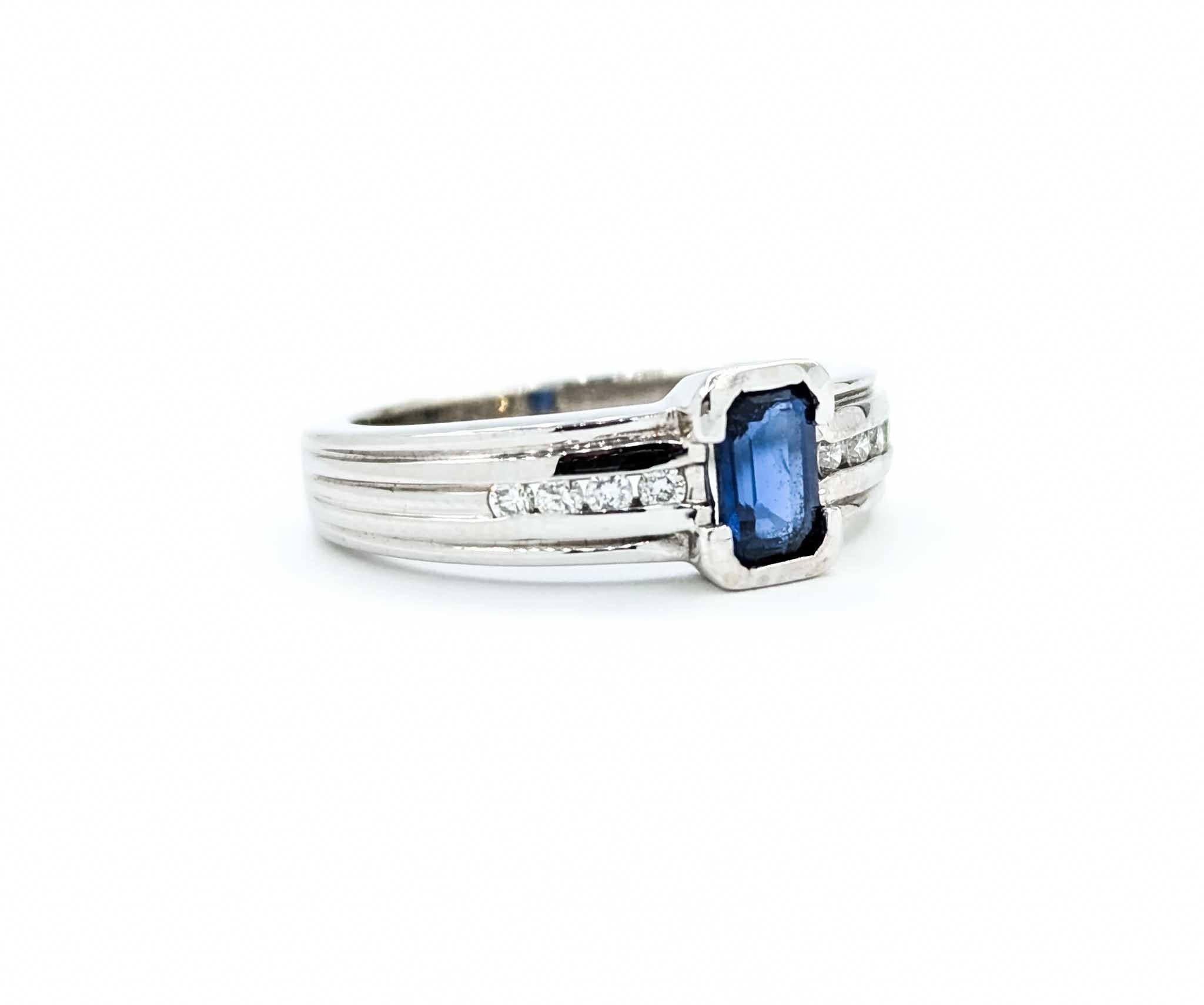 Emerald Cut Sapphire Ring with Channel Set Diamonds in White Gold For Sale 2